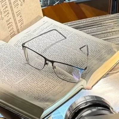 The client’s father’s glasses and book, shown before the finished photograph.