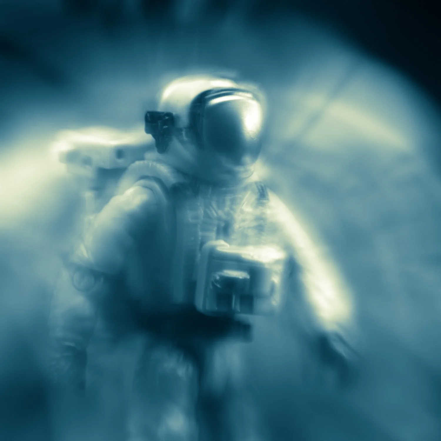An astronaut photographed by Mark Robert Halper in luminous blue light.