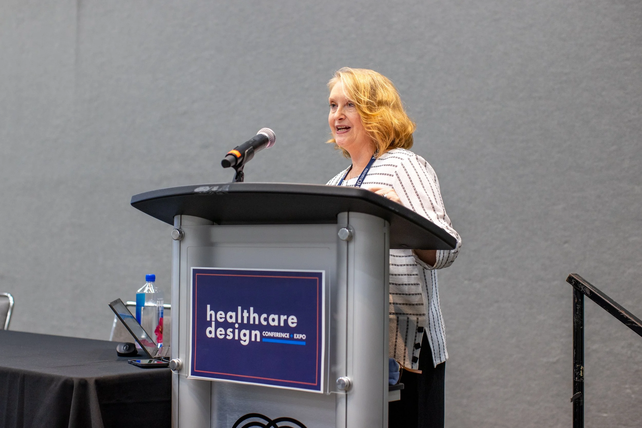 Woman speaking at healthcare conference