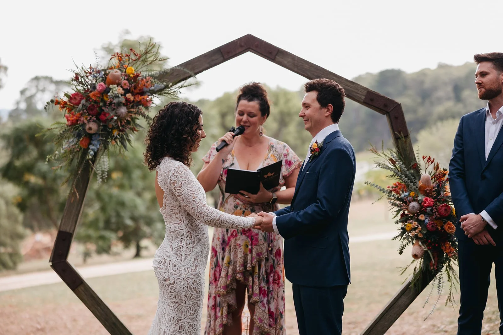 Claire Russo celebrant marrying Amelia and James during their garden wedding.  In the forest ceremony location at wedding venue Butterfly Red Hill, on the Mornington Peninsula.