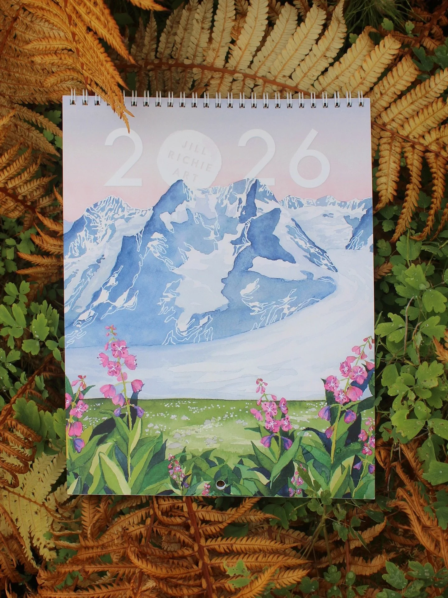 🌿2026 Art Calendar 🌿

Experience Alaska&rsquo;s shifting colors, textures, and landscapes through twelve original watercolor paintings. Each month features a perforated page that can be easily removed and framed, letting you enjoy the artwork month
