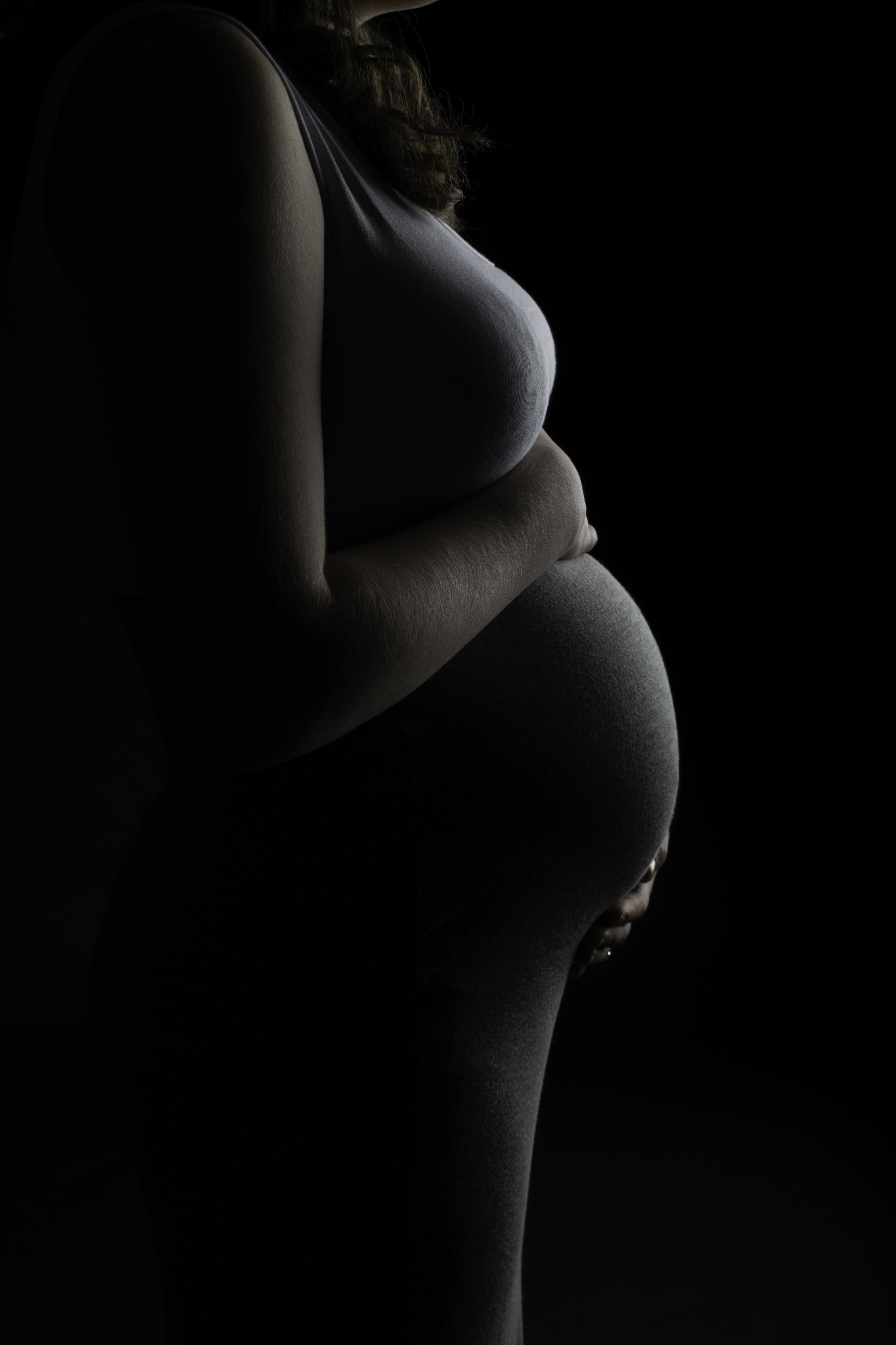 A maternity portrait in a studio setting