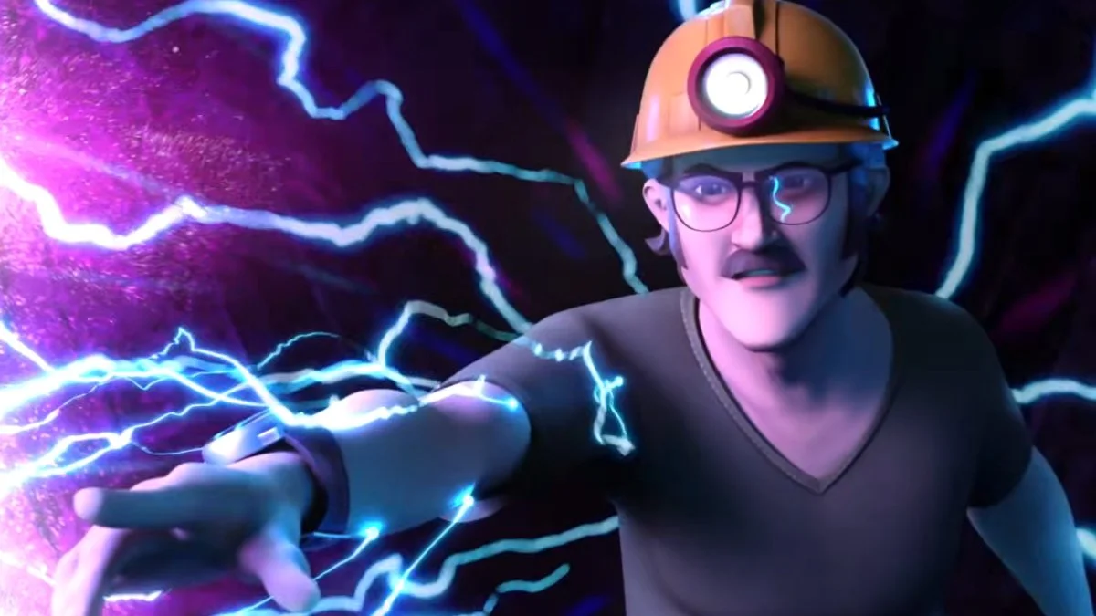 Whit, wearing a hard hat with a light atop it, holds out his hand as blue energy courses around him.