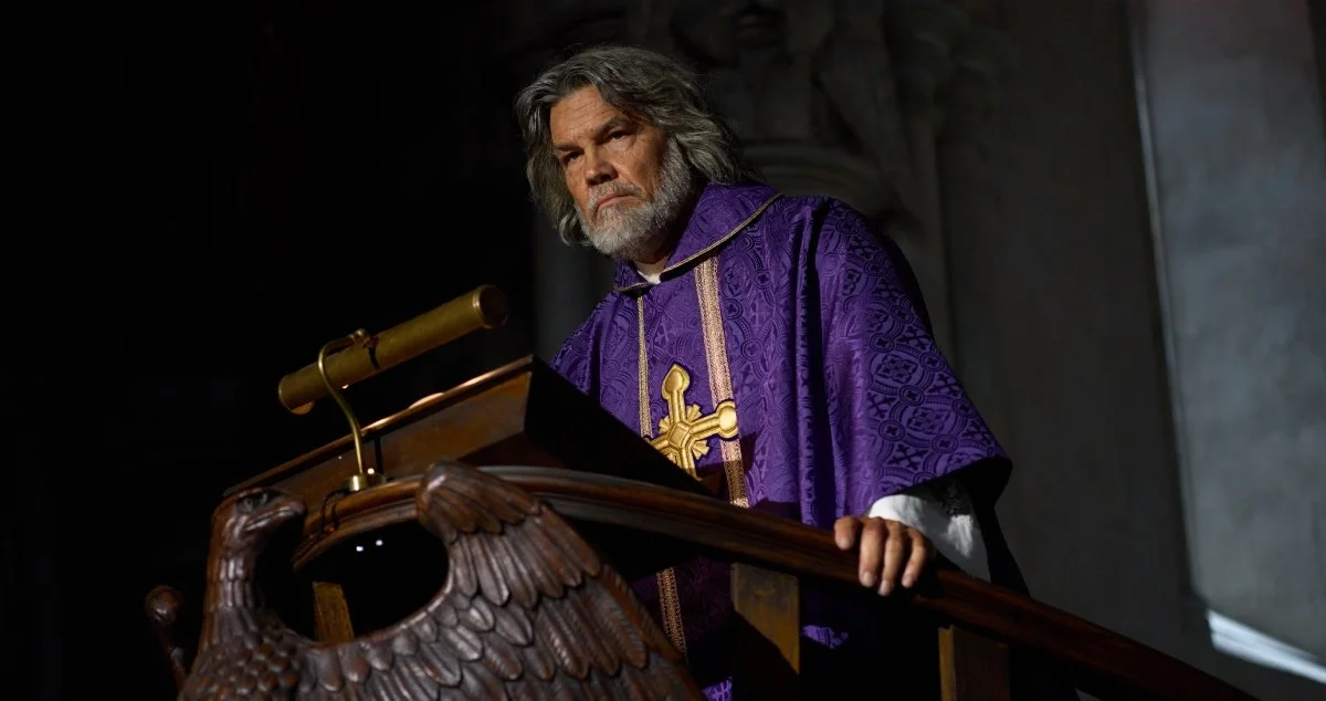 Wicks stands at the pulpit.