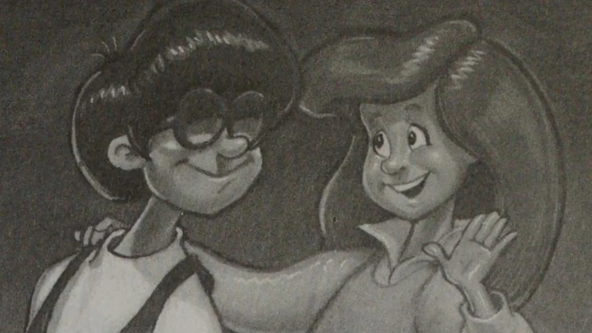 Eugene and Connie from AIO. Connie's right hand is on Eugene's shoulder. She holds up her left hand.