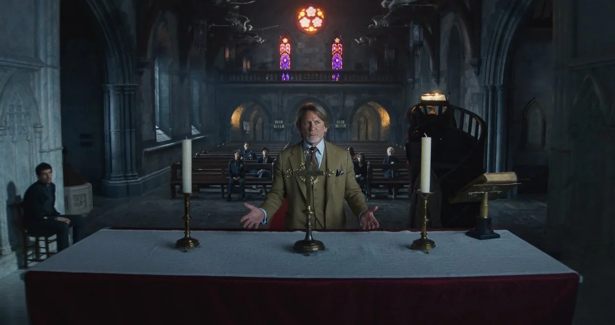 Blanc stands before the suspects, unsure.