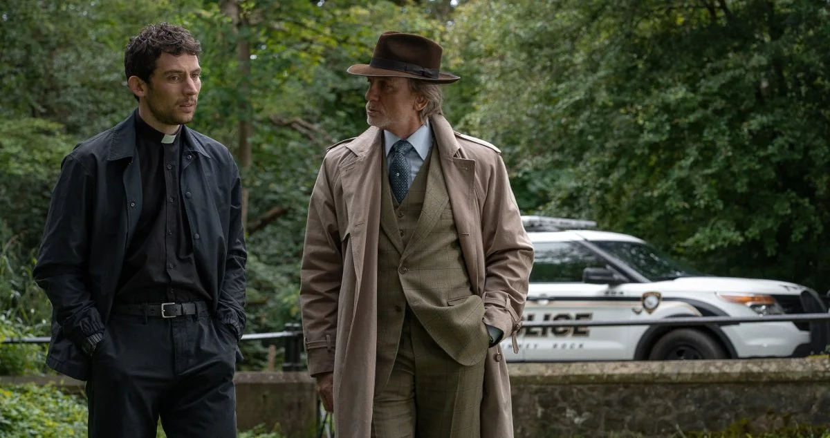 Jud and Blanc walk outside, a police car behind them.