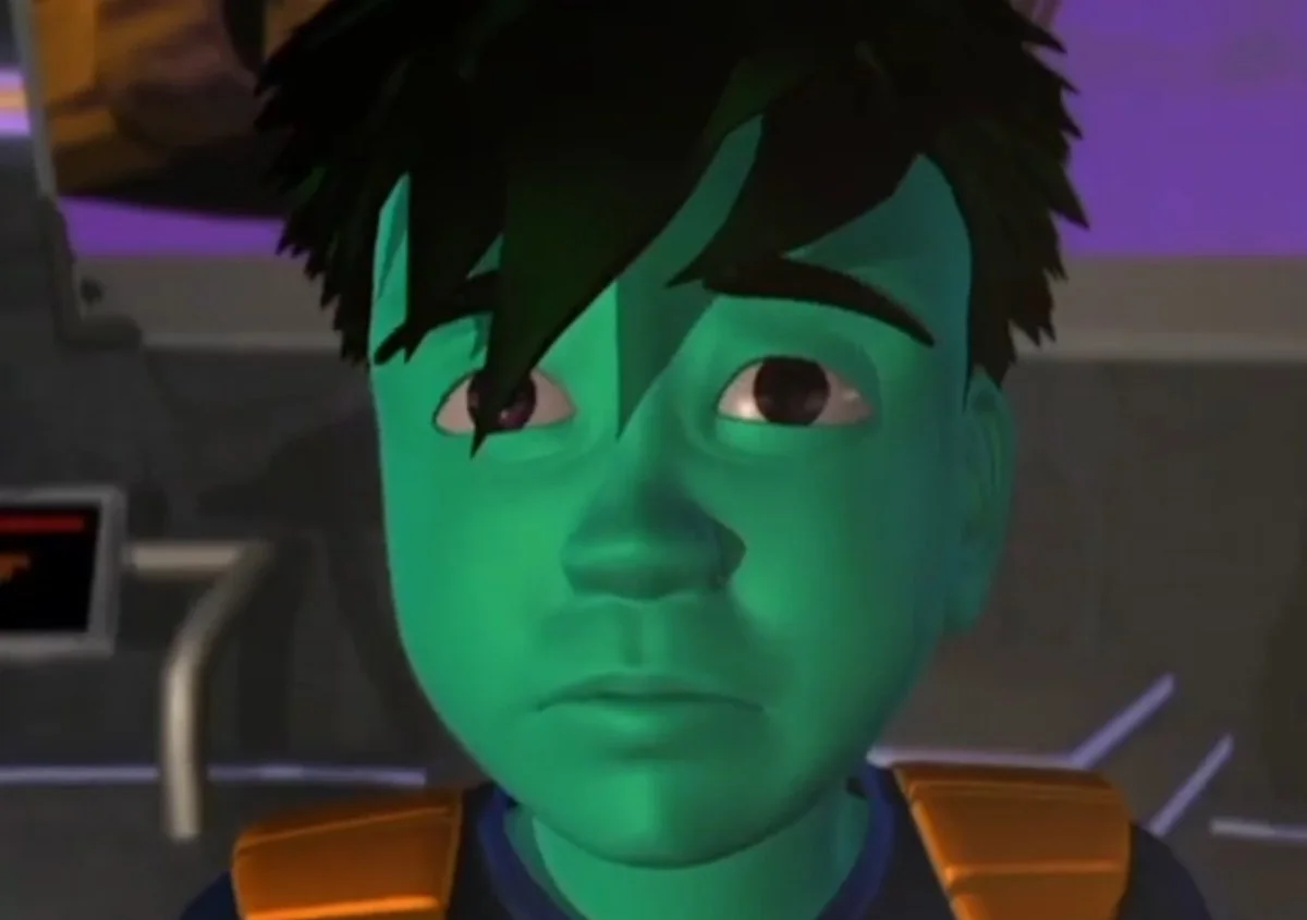 Enzo, a green skinned computer program boy, looks on, worried.