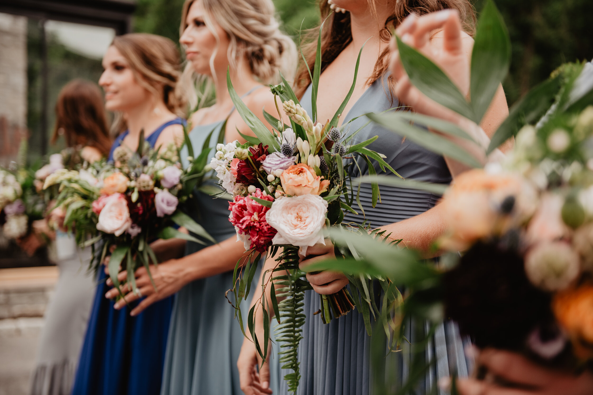 Canva - Selective Focus Photography of Women Holding Wedding Flowers.jpg