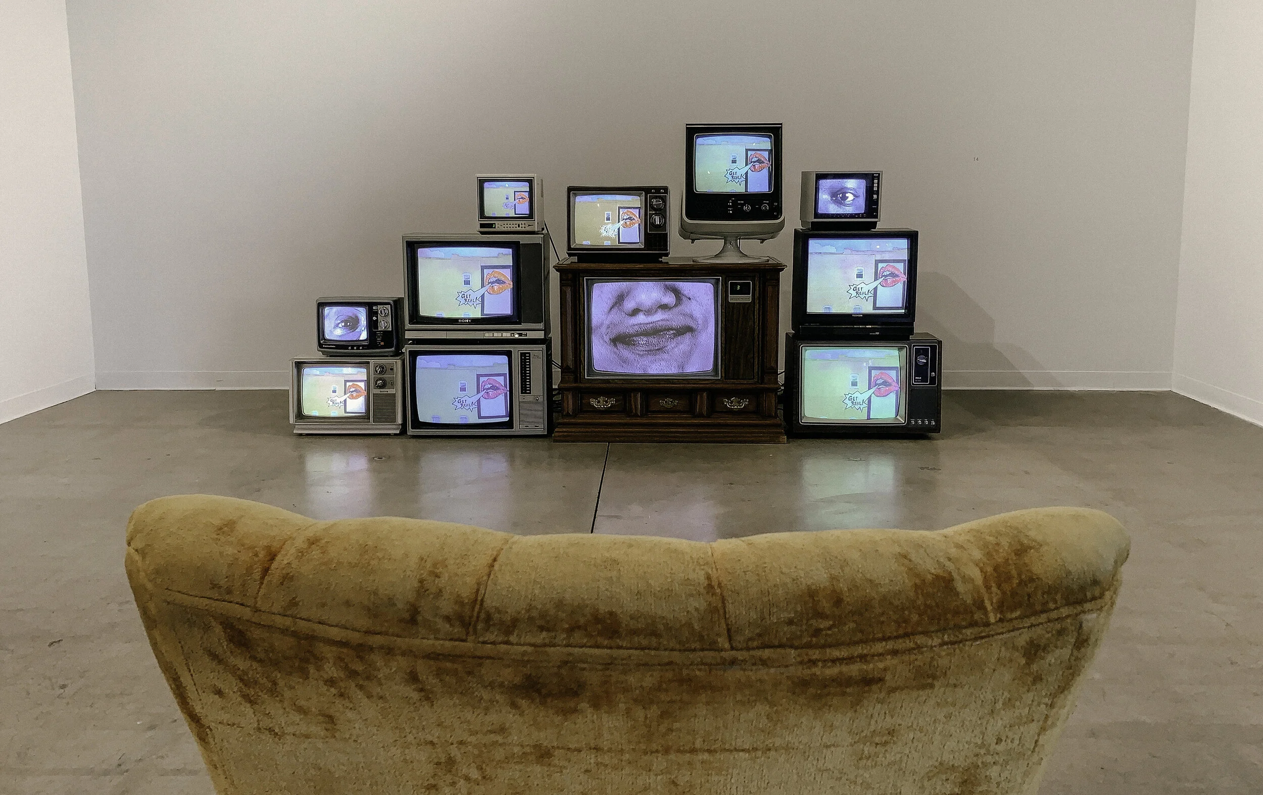 32 Words - 512 eyes - 256 Mouths - 11 Televisions - 1 Chair