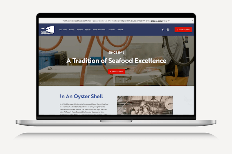 Laptop screen displaying a seafood company's website with a blue logo in the top left corner, a red contact button and phone number, and a large headline that reads 'A Tradition of Seafood Excellence' over a background image of workers processing seafood.