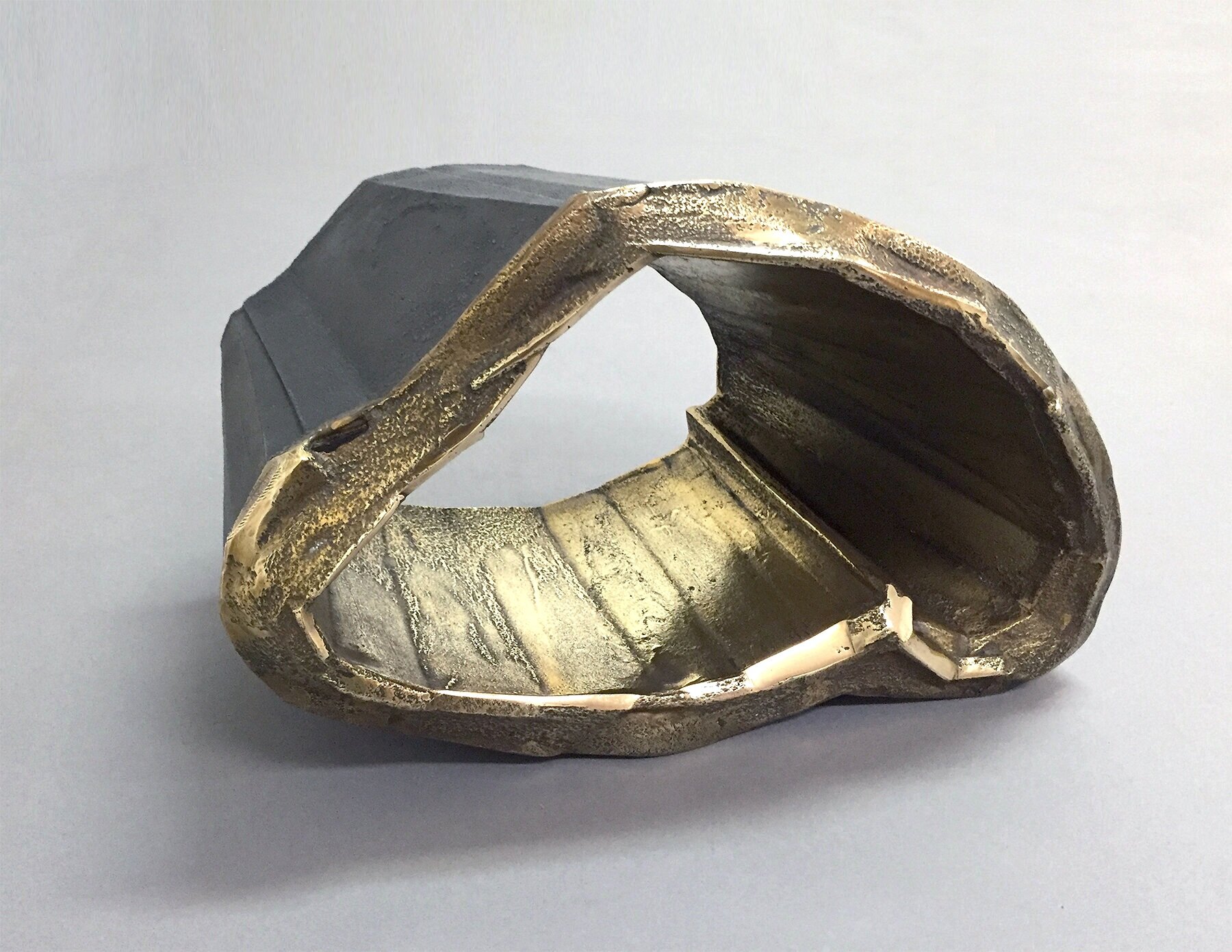 Brass into Iron