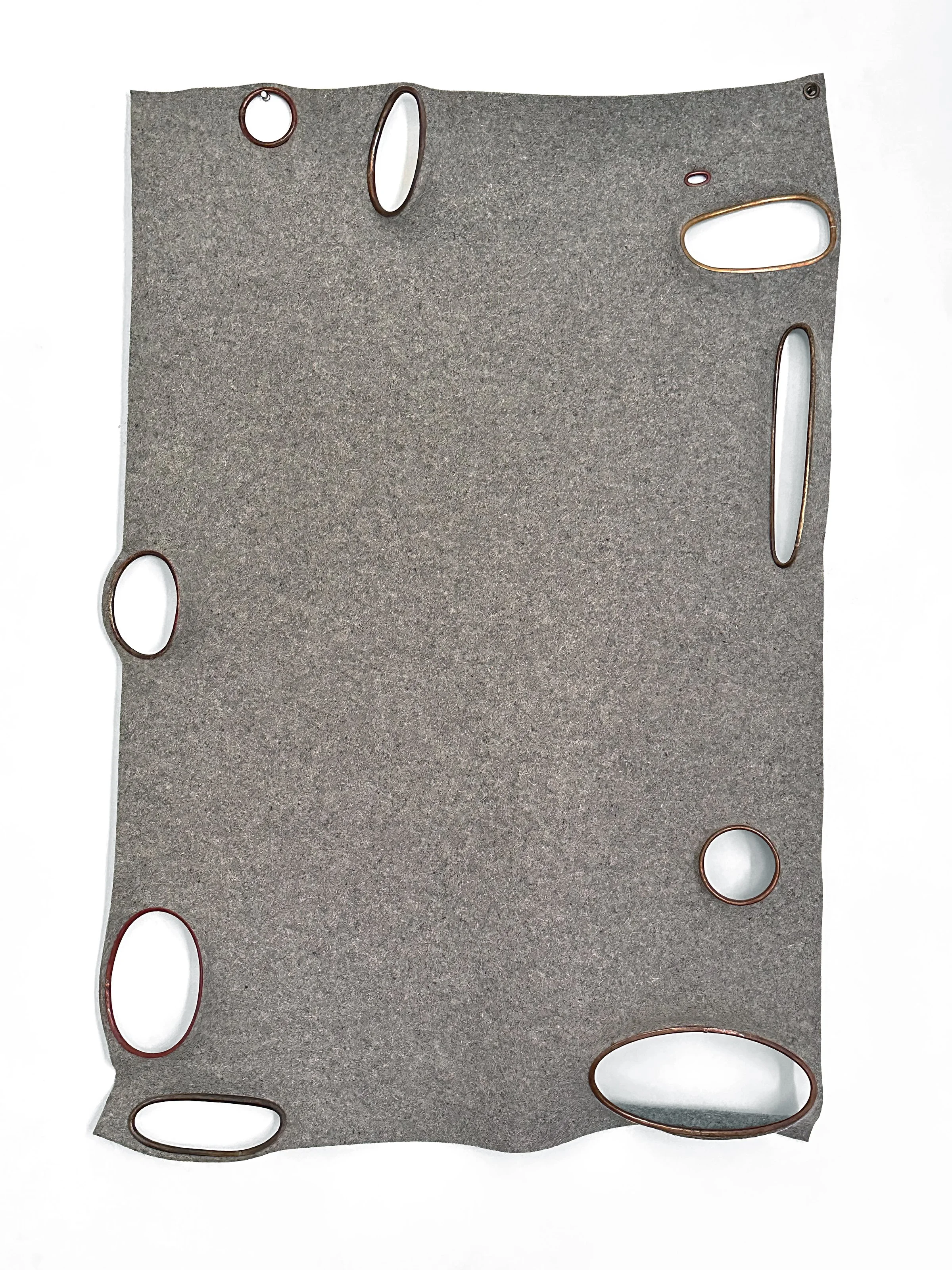 Throw, 2024. Copper, bronze, wool felt. 50 x 35 x 4 in.