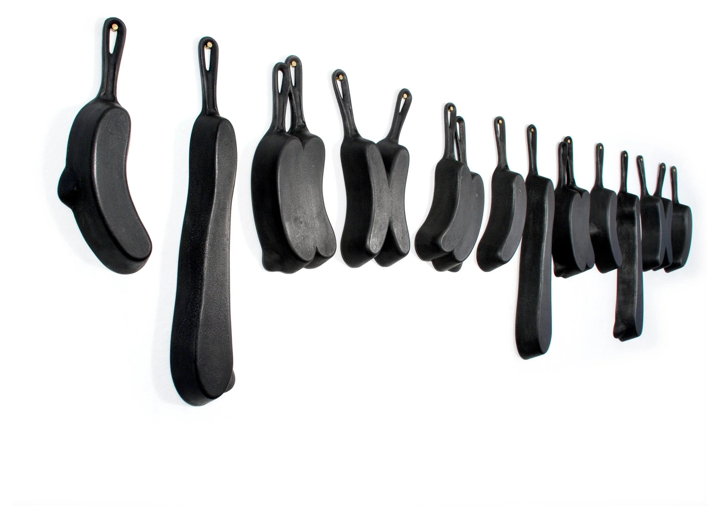 Brat Pans on wall. Dimension: 8 feet across