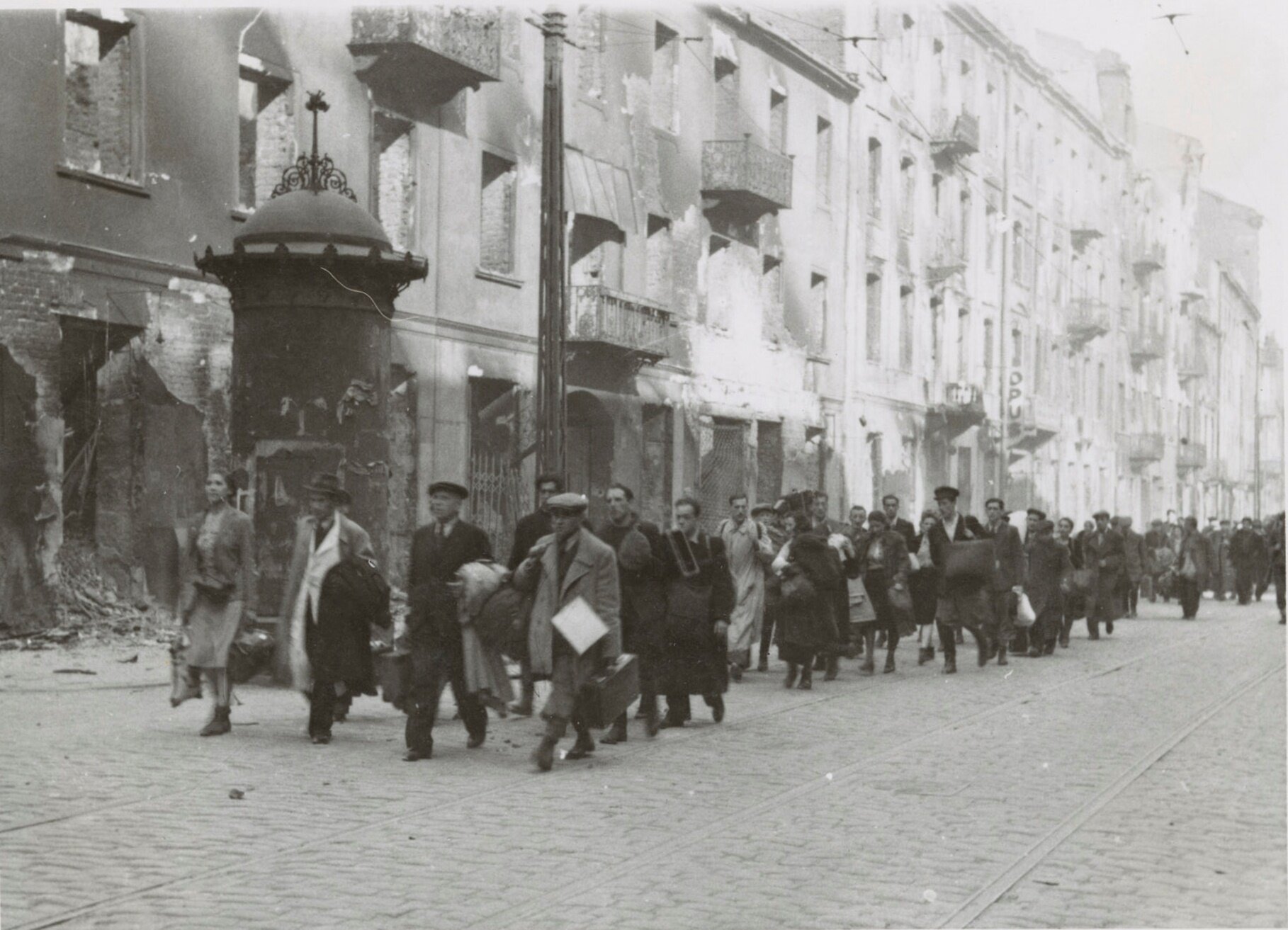 "Captured Jews marched off to the Umschlagplatz for deportation in Zamenhofa Street."