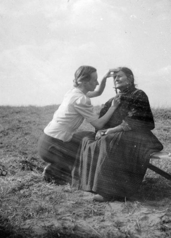 Eva Justin checking the facial characteristics of a Romani woman as part of her "racial studies", Germany 1938. 