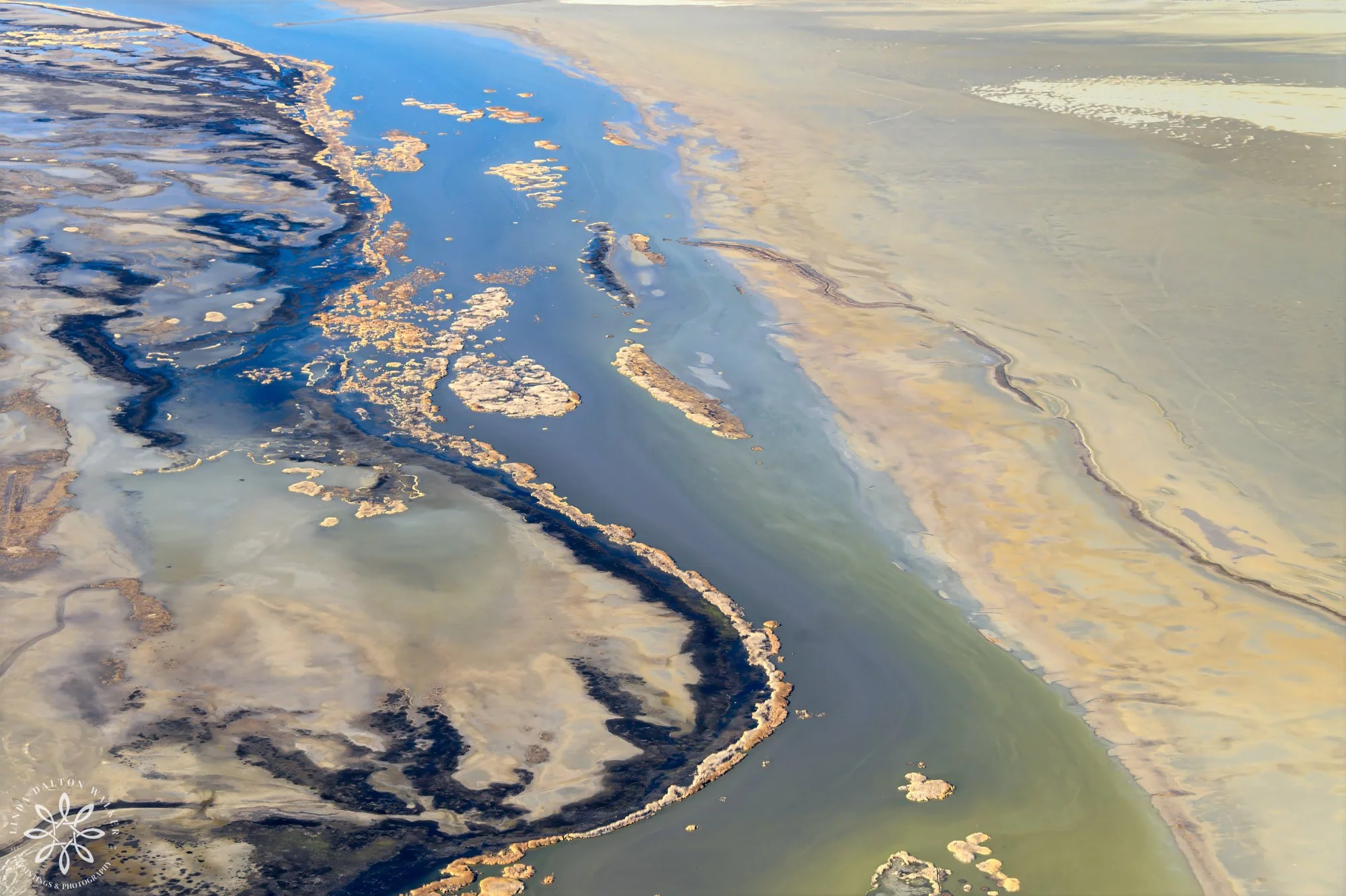 Abstracted view of water flowing between two shores