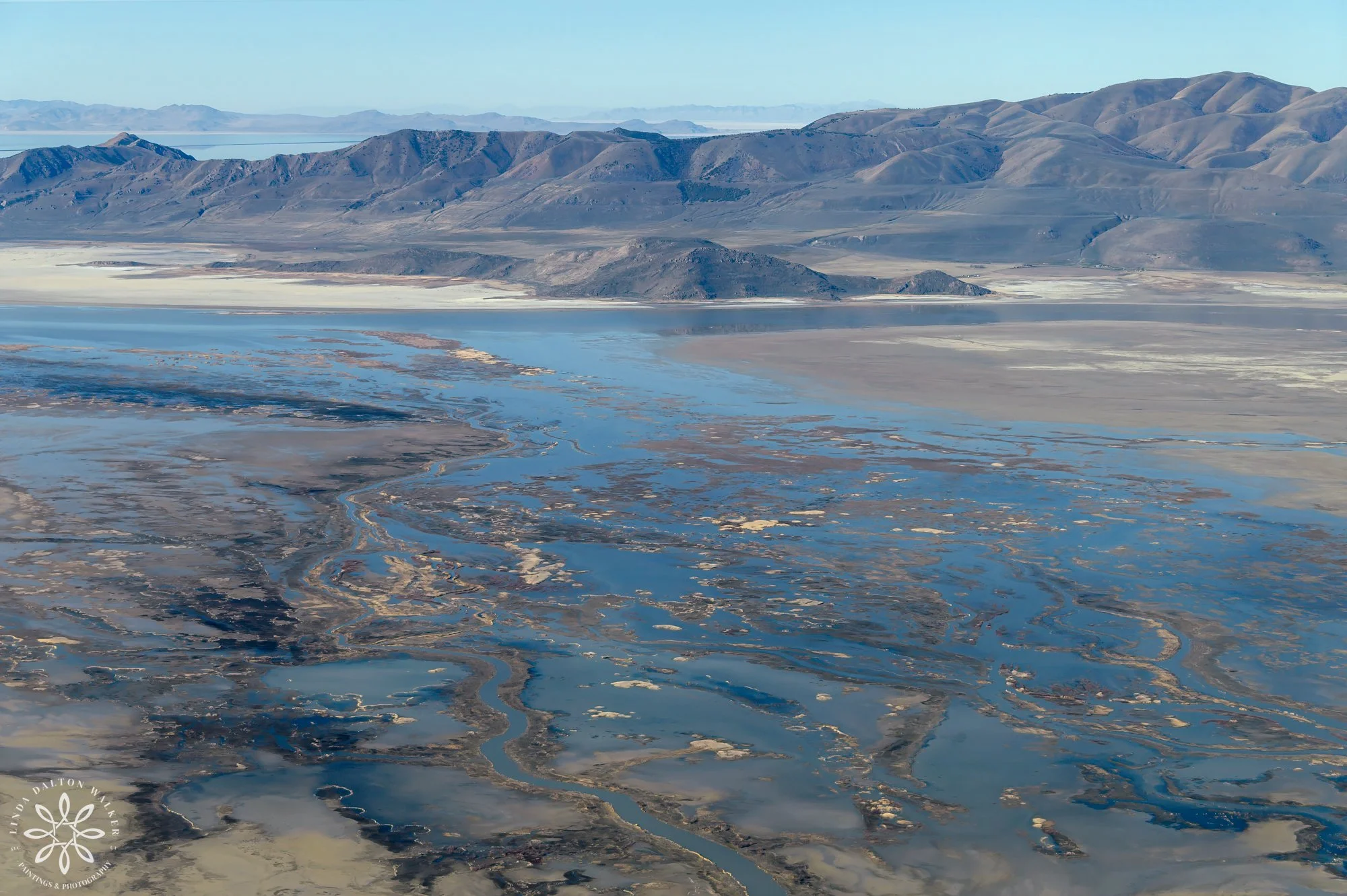 View of Promontory mountain with a trickle of great salt lake in front