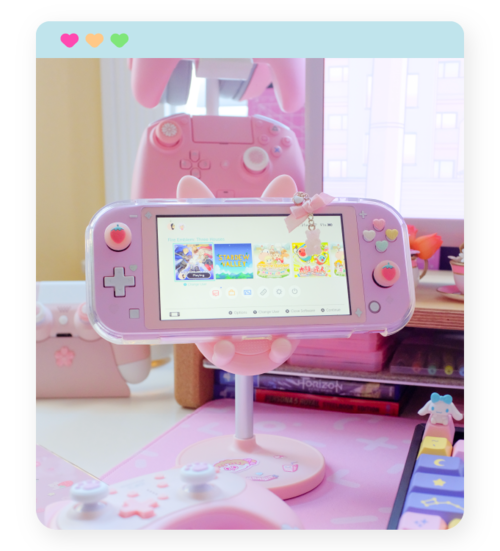 Bunny Device StandThis adorable stand sits can hold a Switch Lite, original Switch, pretty much every smartphone, and probably every tablet! The height and viewing angle are both adjustable, but we all know the main reason I love it is because it gi…