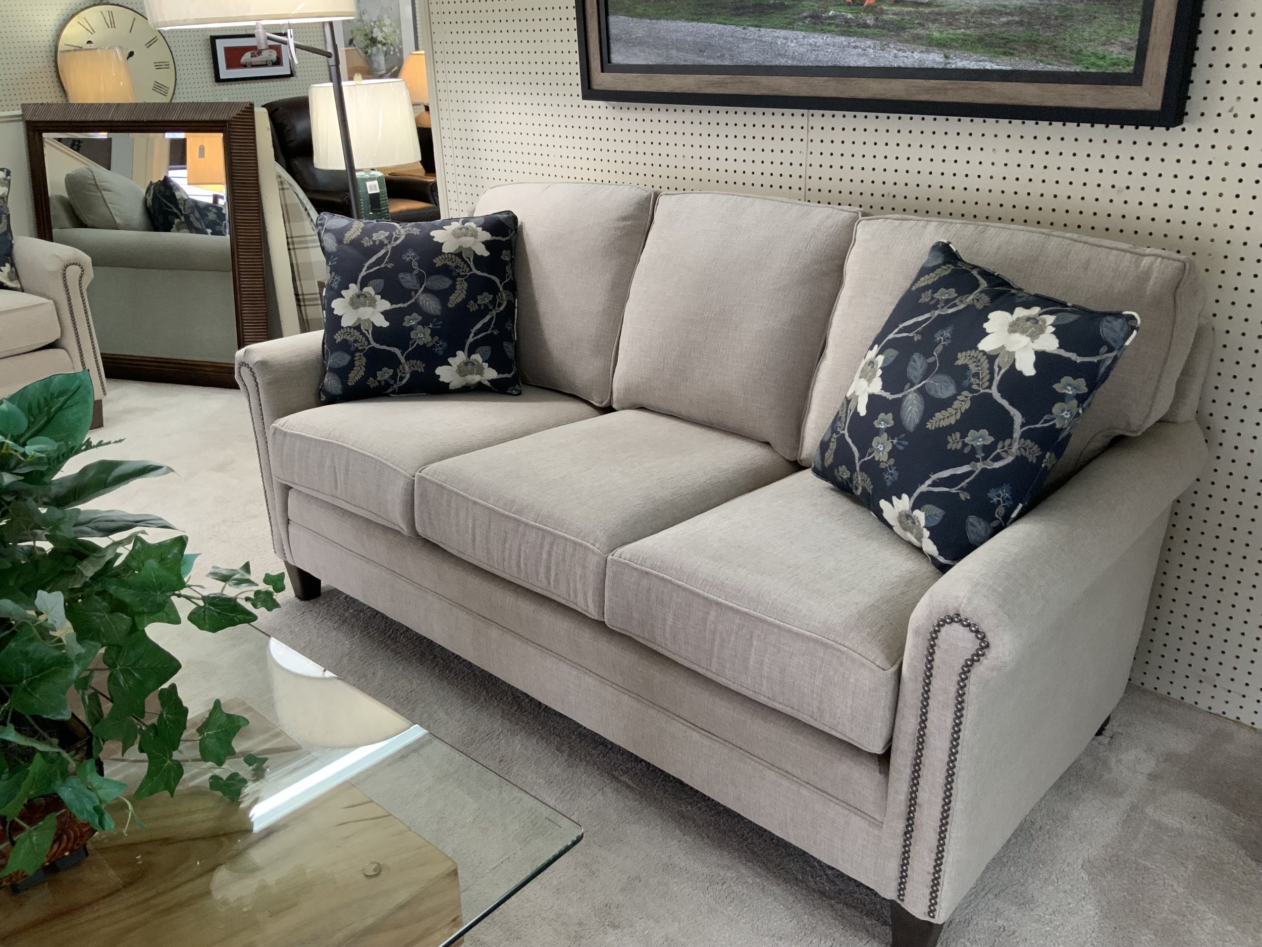Smith Brothers - 74” mid-sized sofa in cream colored fabric with nailheads 