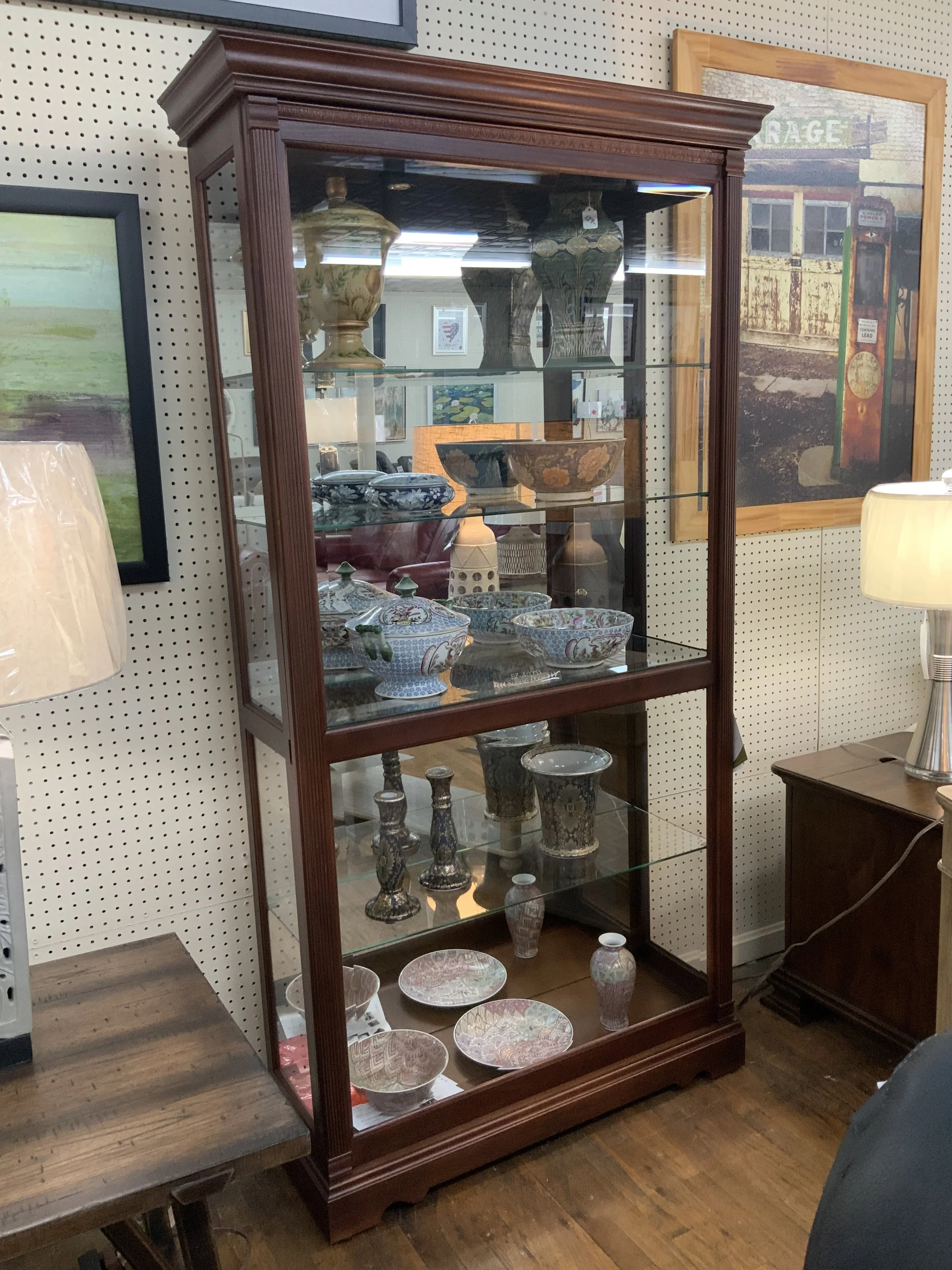 Howard Miller - Dublin curio. 80” H x 42.5” W x 14.75 D in Windsor Cherry.