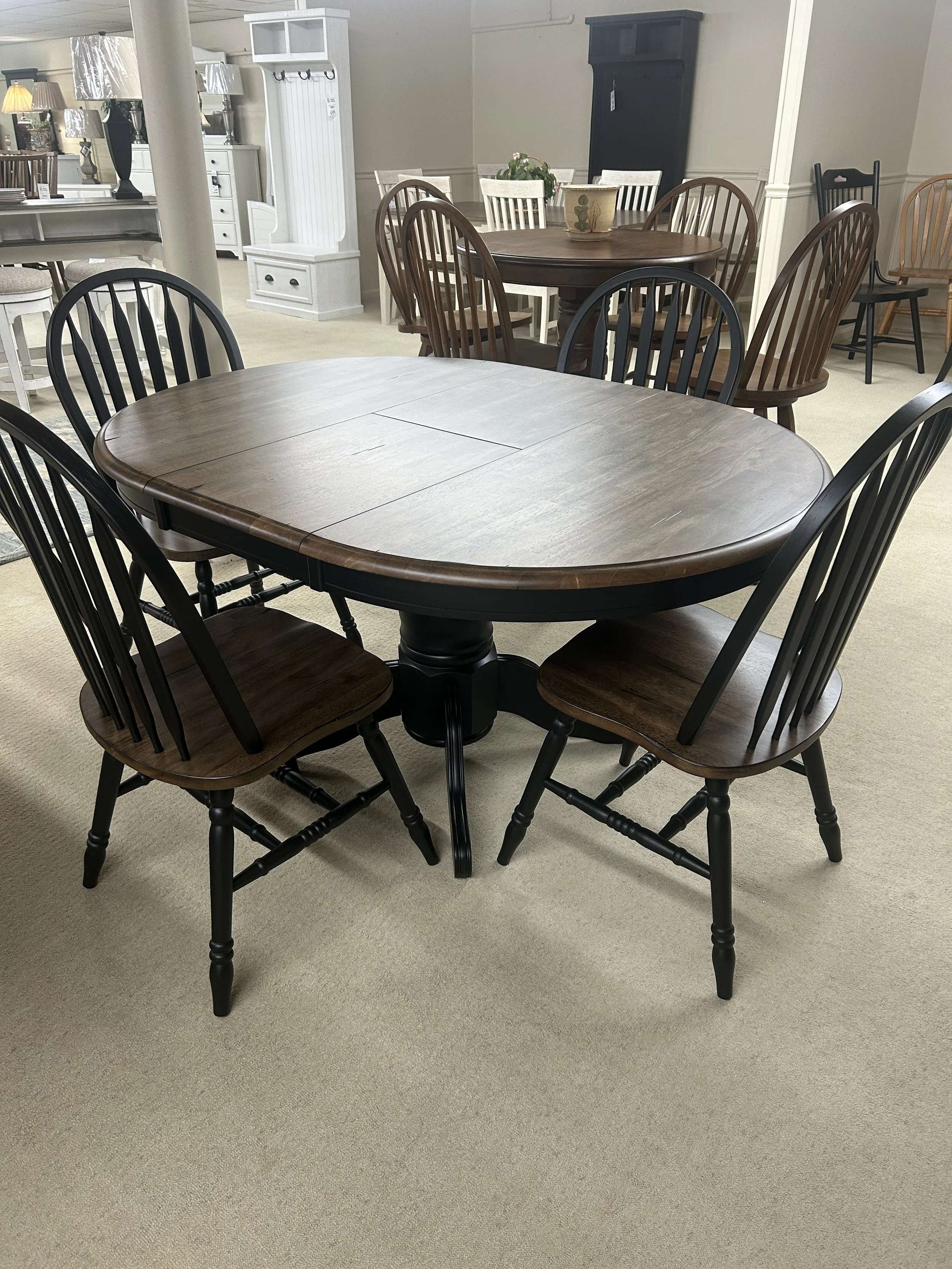 42” round pedestal table with 15” butterfly self-storing leaf (expands to 57” x 42”) in black and antique honey finish on solid wood with 4 Windsor side chairs - from the Carolina Crossing collection by Liberty 