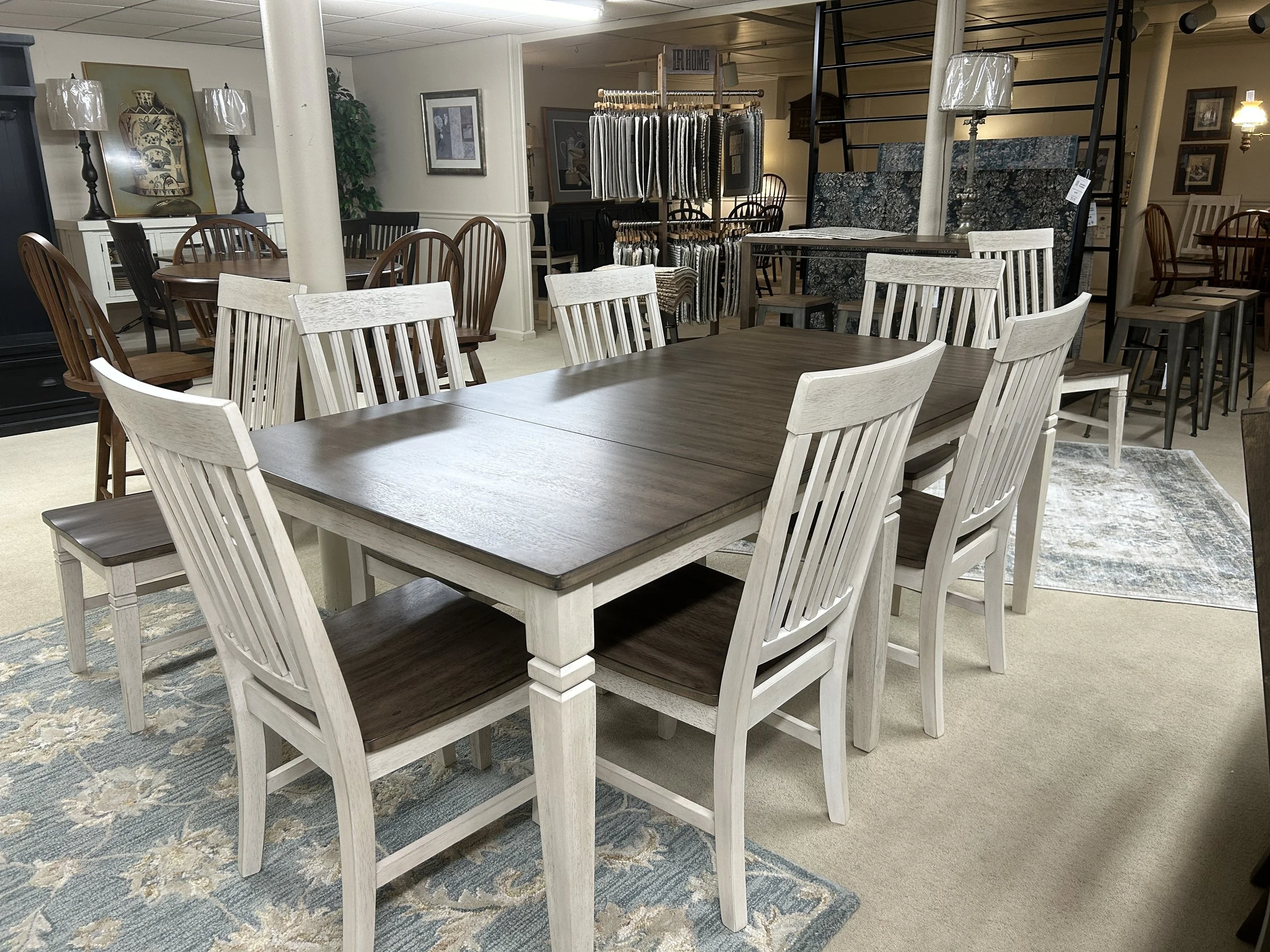 A-America: Beacon collection solid hardwood leg-table 42" x 72" (expands to 114" with two 18" self-storing leaves) in two-tone finish: peppercorn and smoky white.  Comes with 8 slat-back side chairs in two-tone finish. 