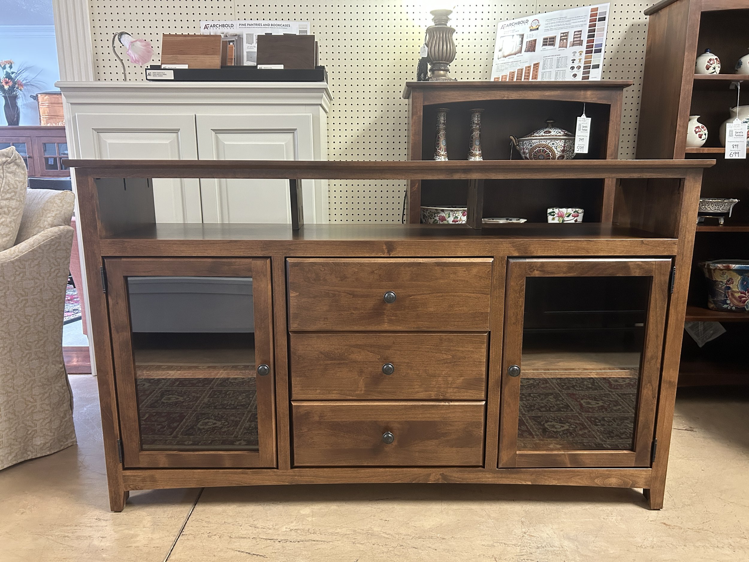 Archbold - 61" long x 37" high entertainment console in tuscan brown finish on solid Alder hardwood. Made in the USA.