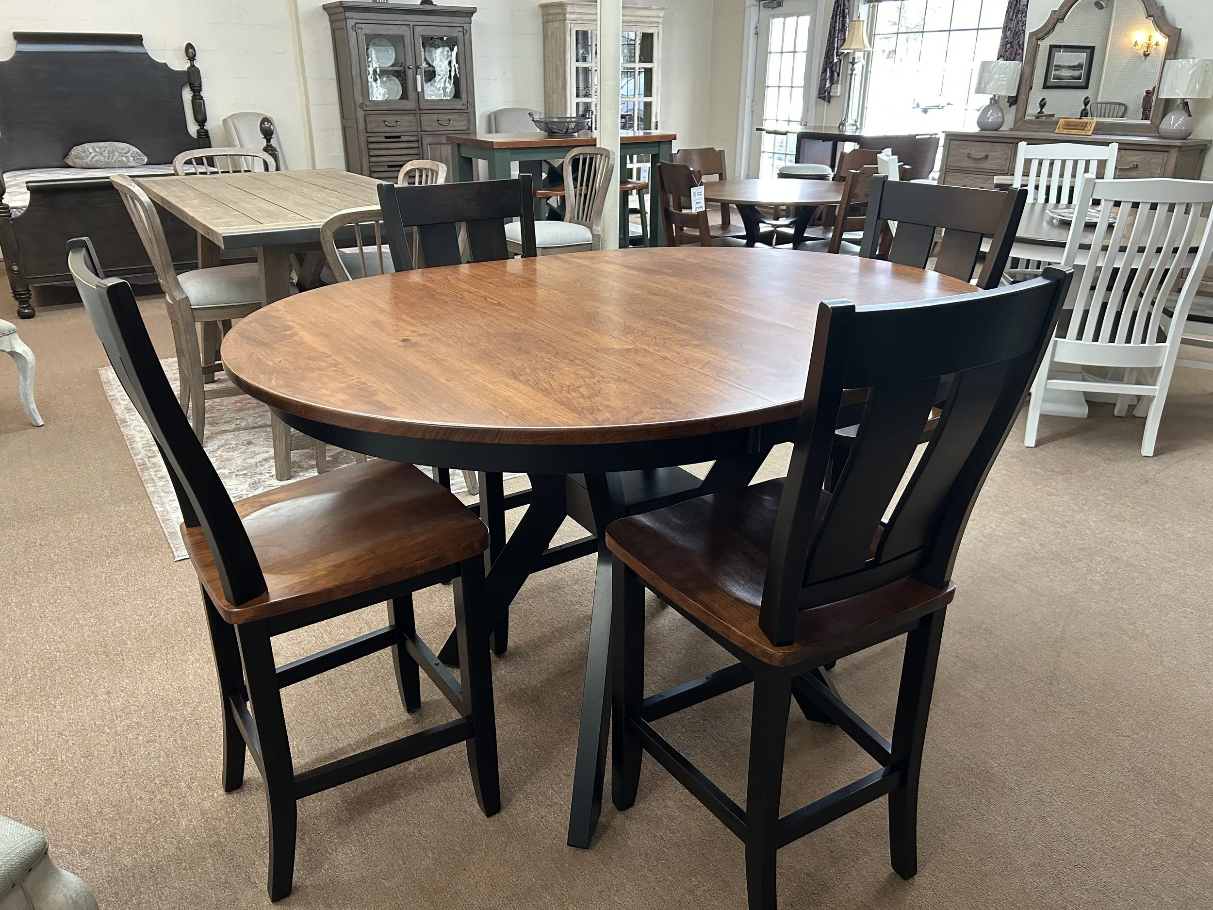 Pub height 48” round cherry table  with one 12” leaf (expands to 48” x 60”) with four 24” Stella barstools in two-tone finish: Ebony and Michaels - by Mavin 
