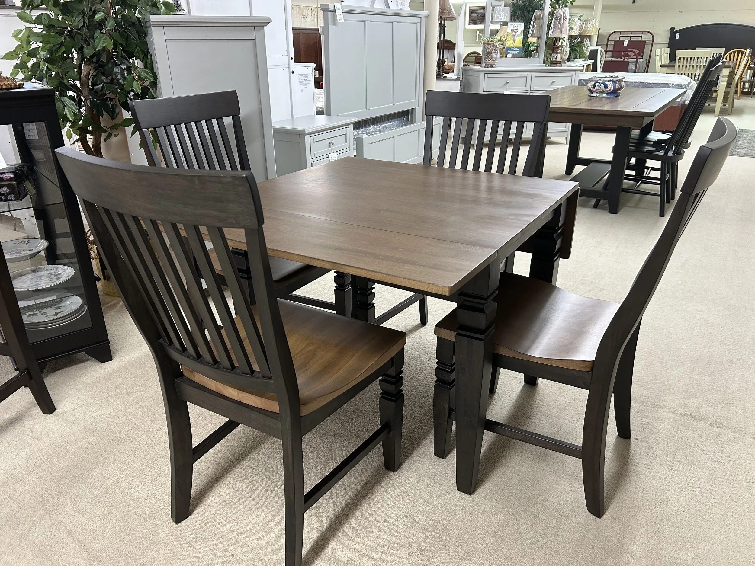36” x 30” solid hardwood table with two drop-leaves (expands to 50”) and four slat-back side chairs in charcoal & toffee finish by TEI