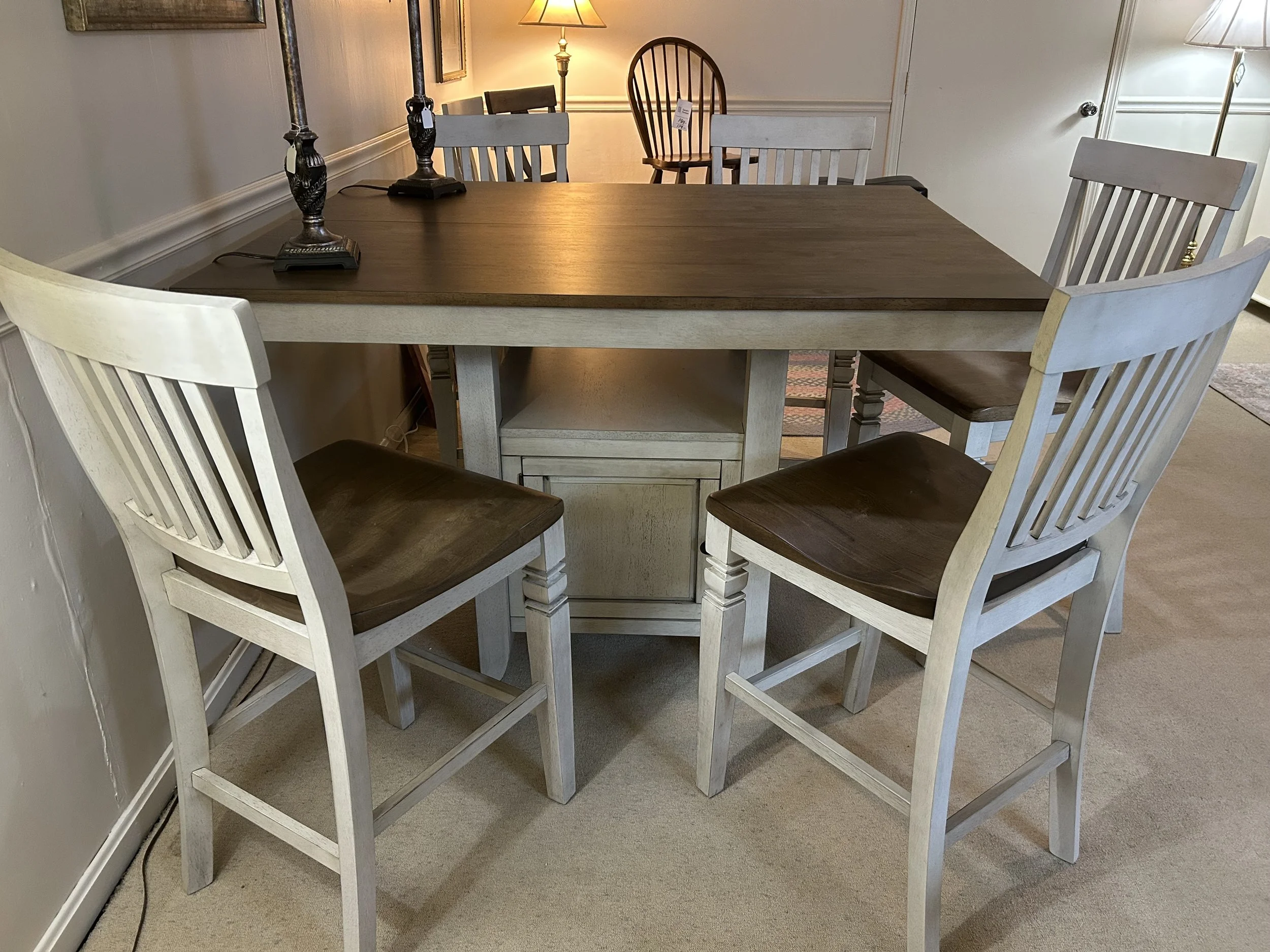 Preston Gathering Table (36“ H) in solid hardwood with two tone finish - white and toffee.  Comes with six 24“ slat-back barstools