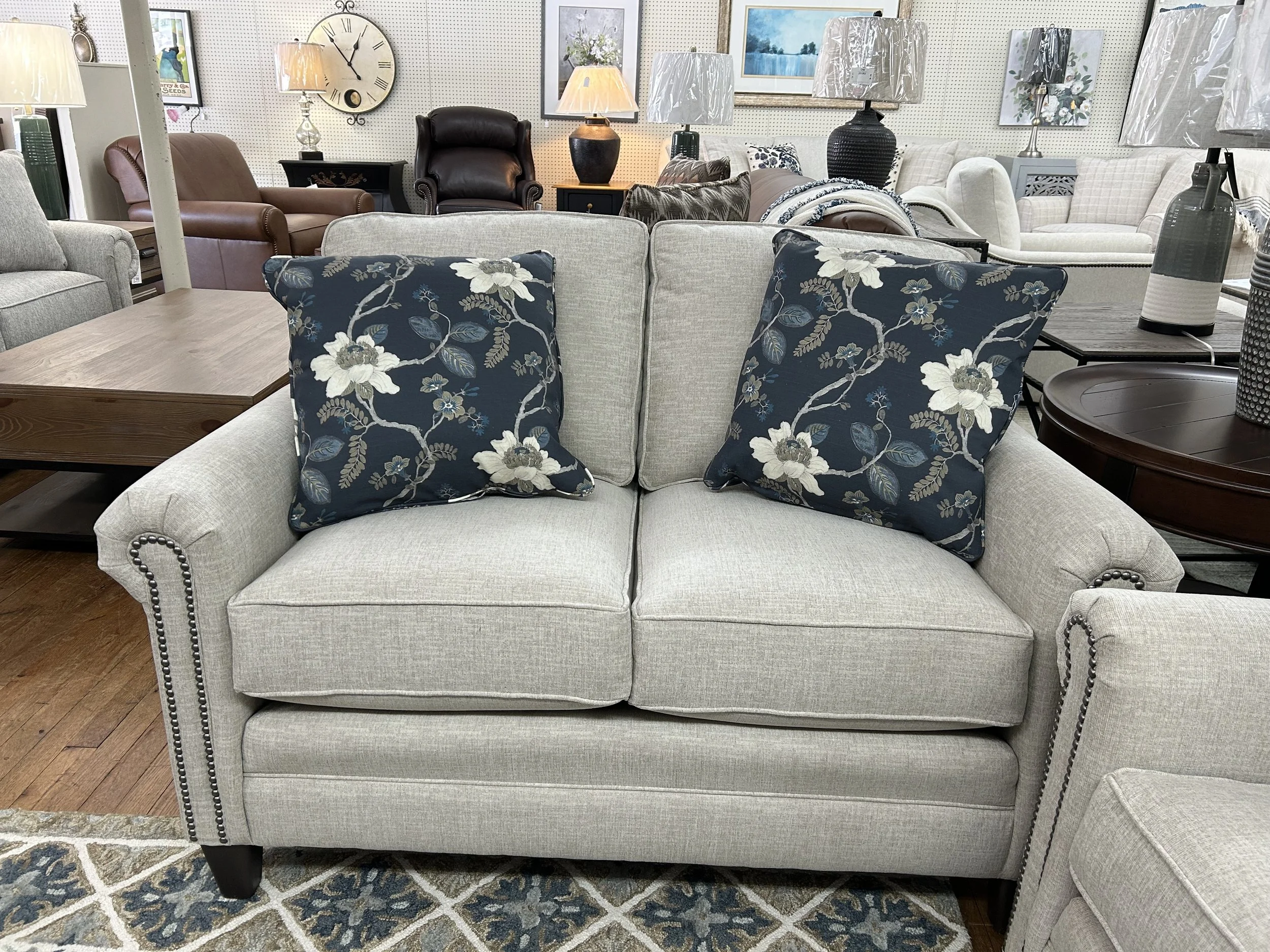 Smith Brothers - loveseat in cream colored fabric with nailheads 