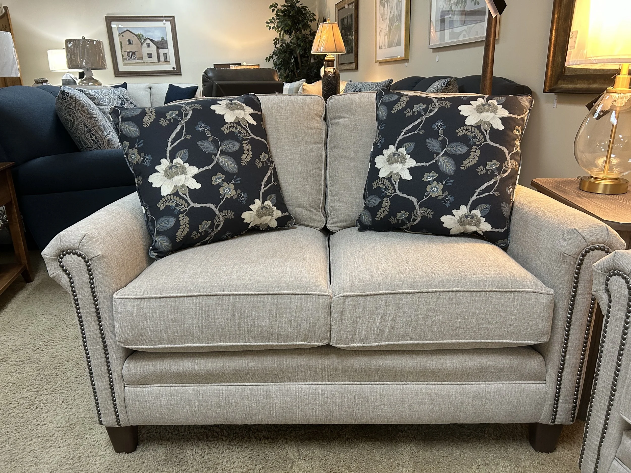 Smith Brothers - 53” loveseat in cream colored fabric with nailheads