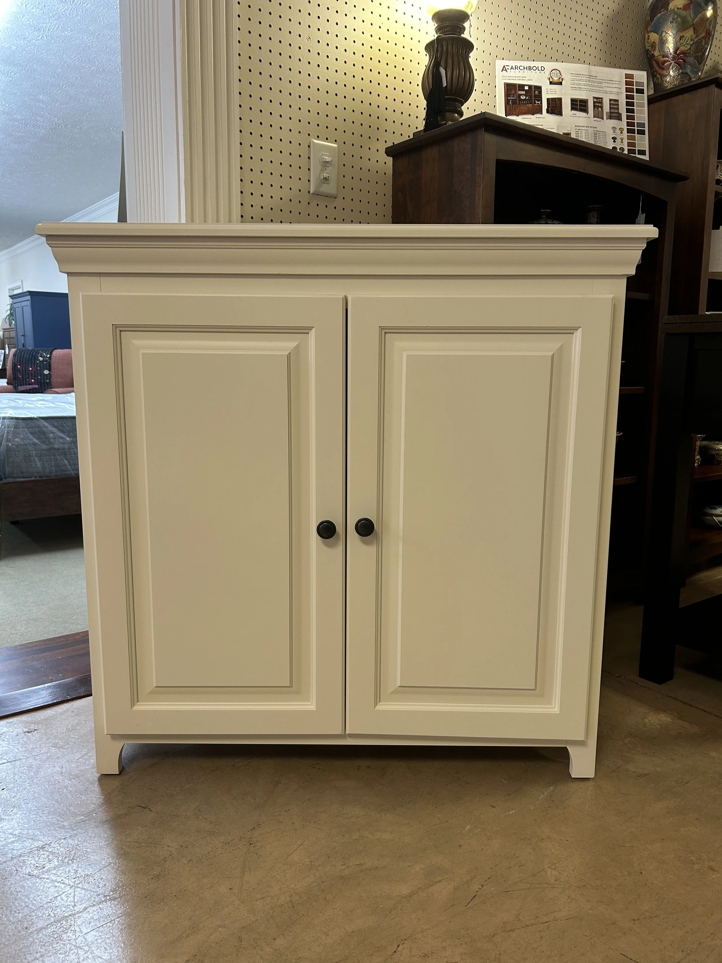 36” two-door cabinet in linen white finish on clean pine by Archbold furniture 