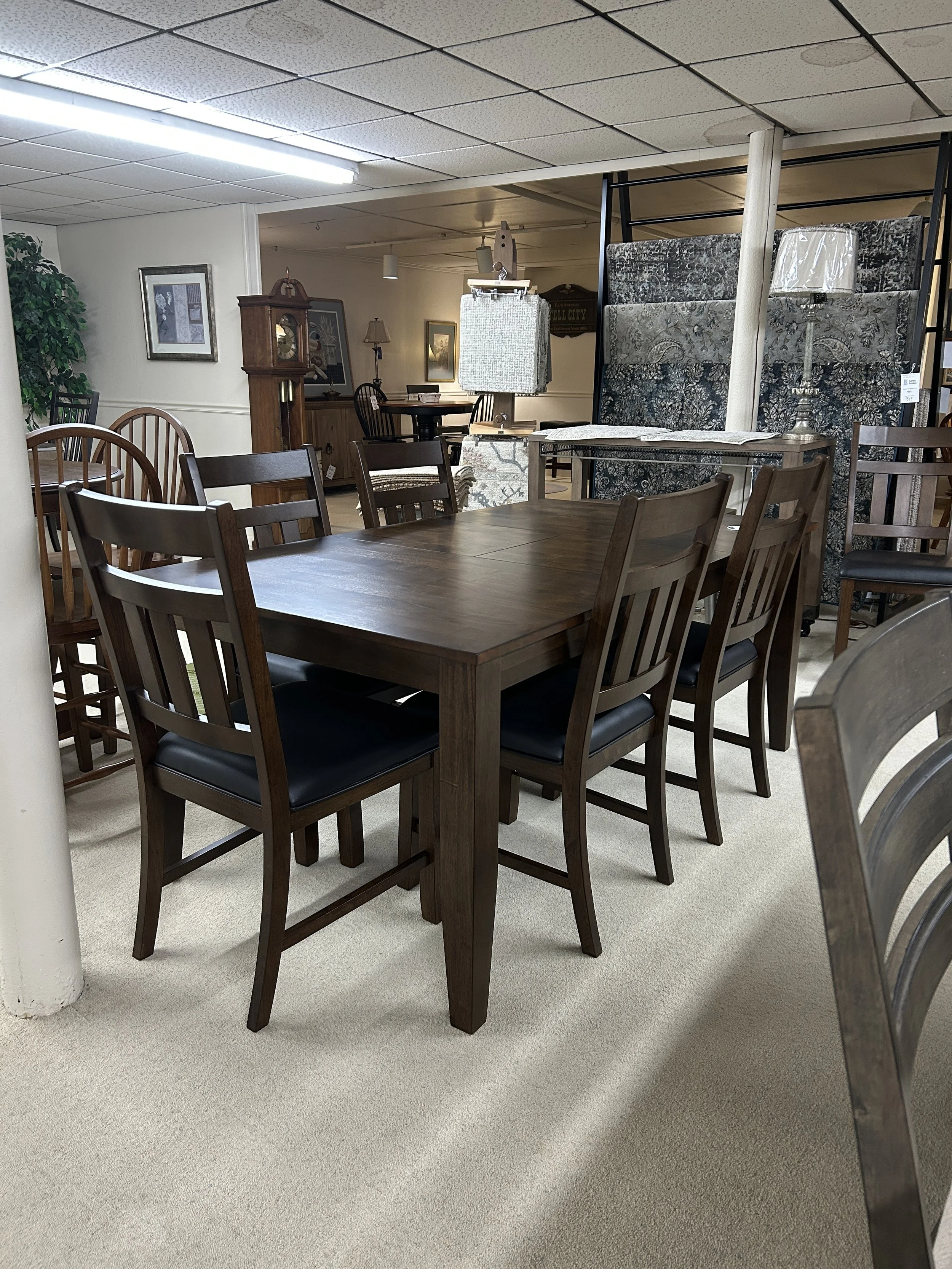 Mason 40" x 54" leg table with one 18" butterfly leaf - expands to 72".  Comes with 6 upholstered side chairs.  Solid hardwood set with Mango table-top by A-American.