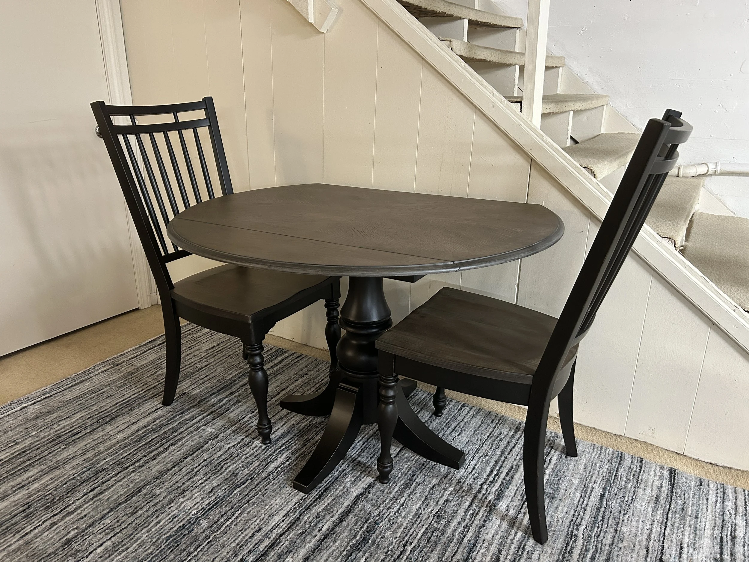 Liberty 44” round drop-leaf pedestal table with two side chairs in two tone finish