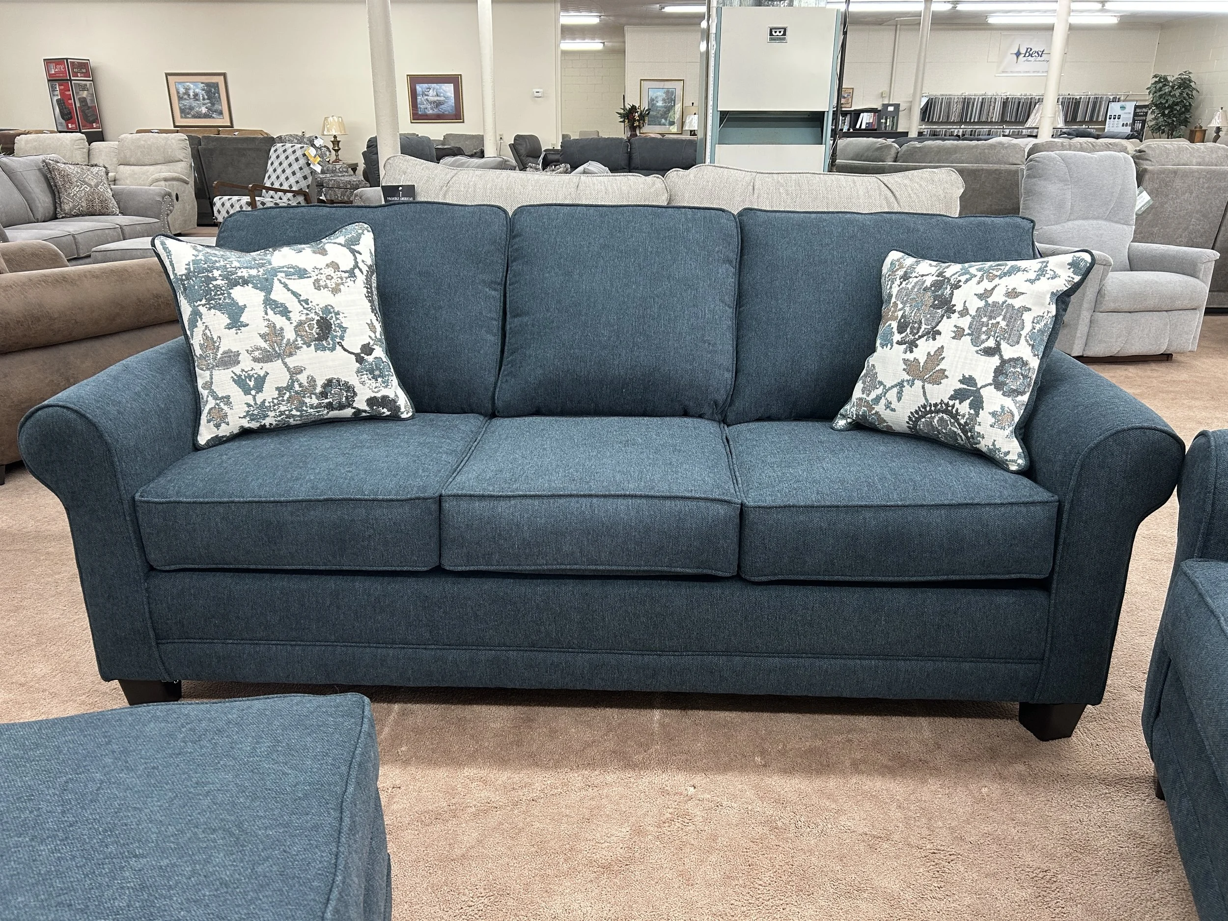 Hughes Furniture sofa in Lotus Aegean dark blue fabric