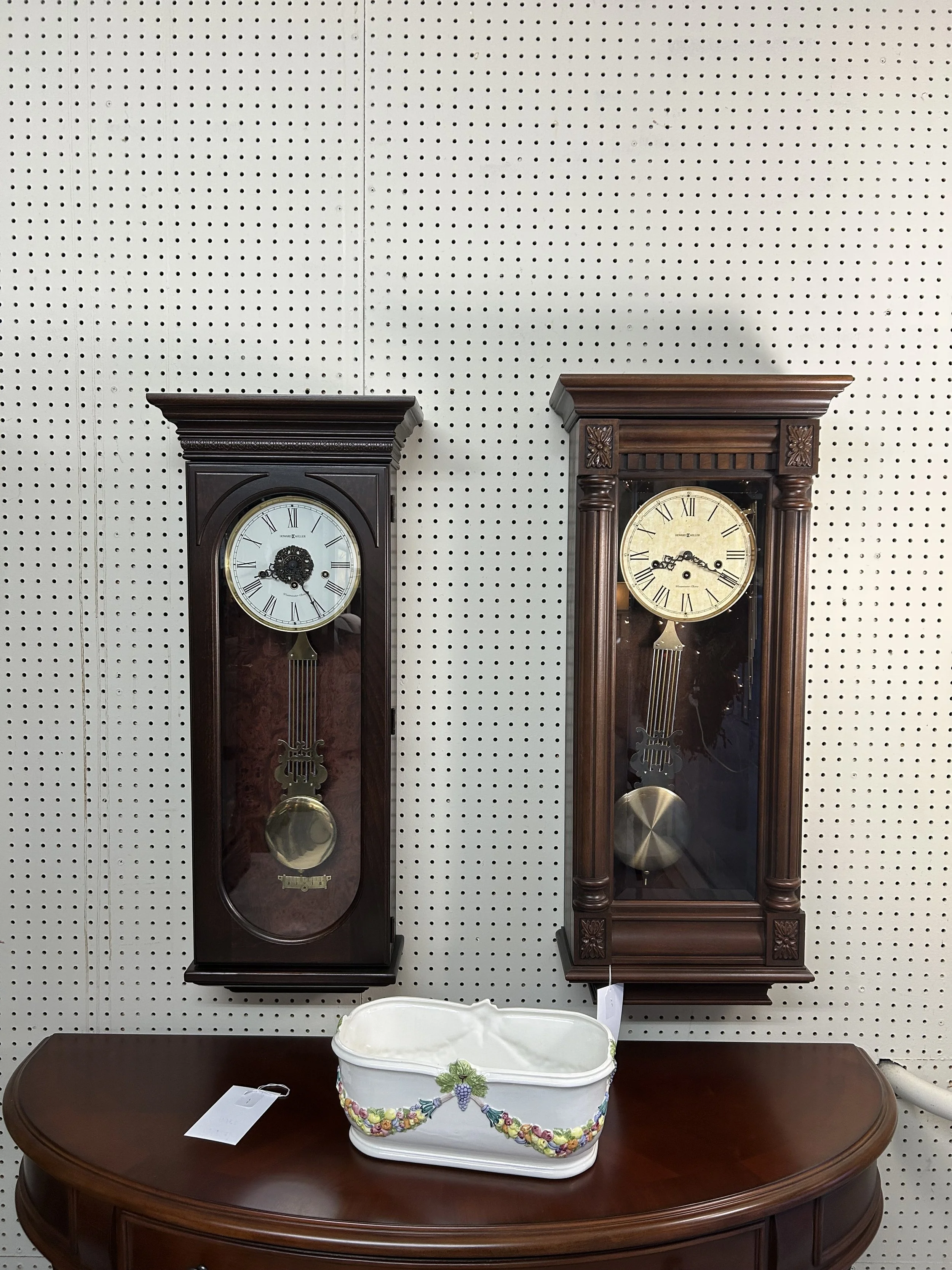 Howard Miller key-wound mechanical wall clocks - Earnest (left) in Hampton cherry finish, New Haven (right) 