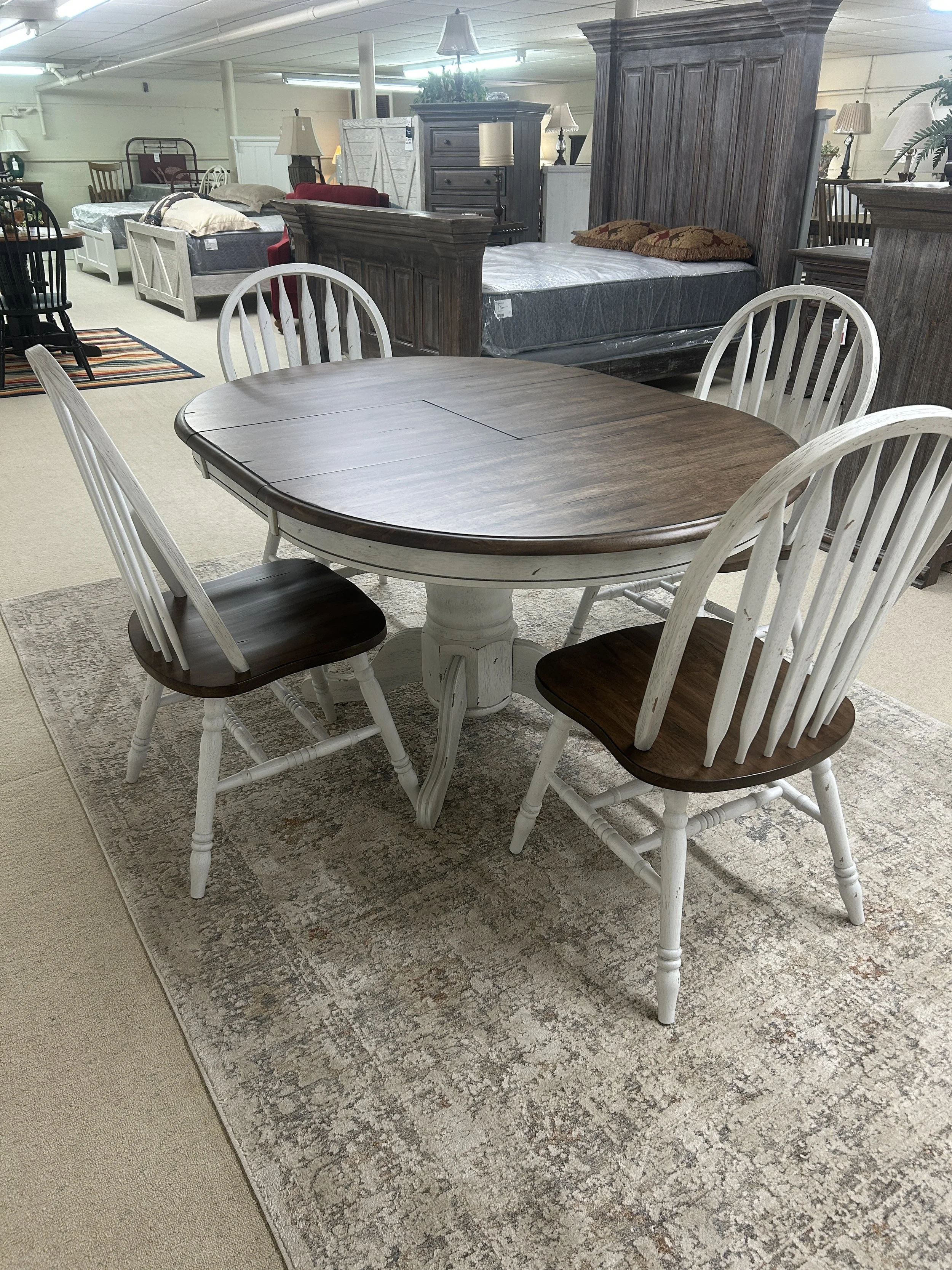42” round pedestal table with 15” butterfly self-storing leaf (expands to 57” x 42”) in rustic white and antique honey finish on solid wood with 4 Windsor side chairs - from the Carolina Crossing collection by Liberty 