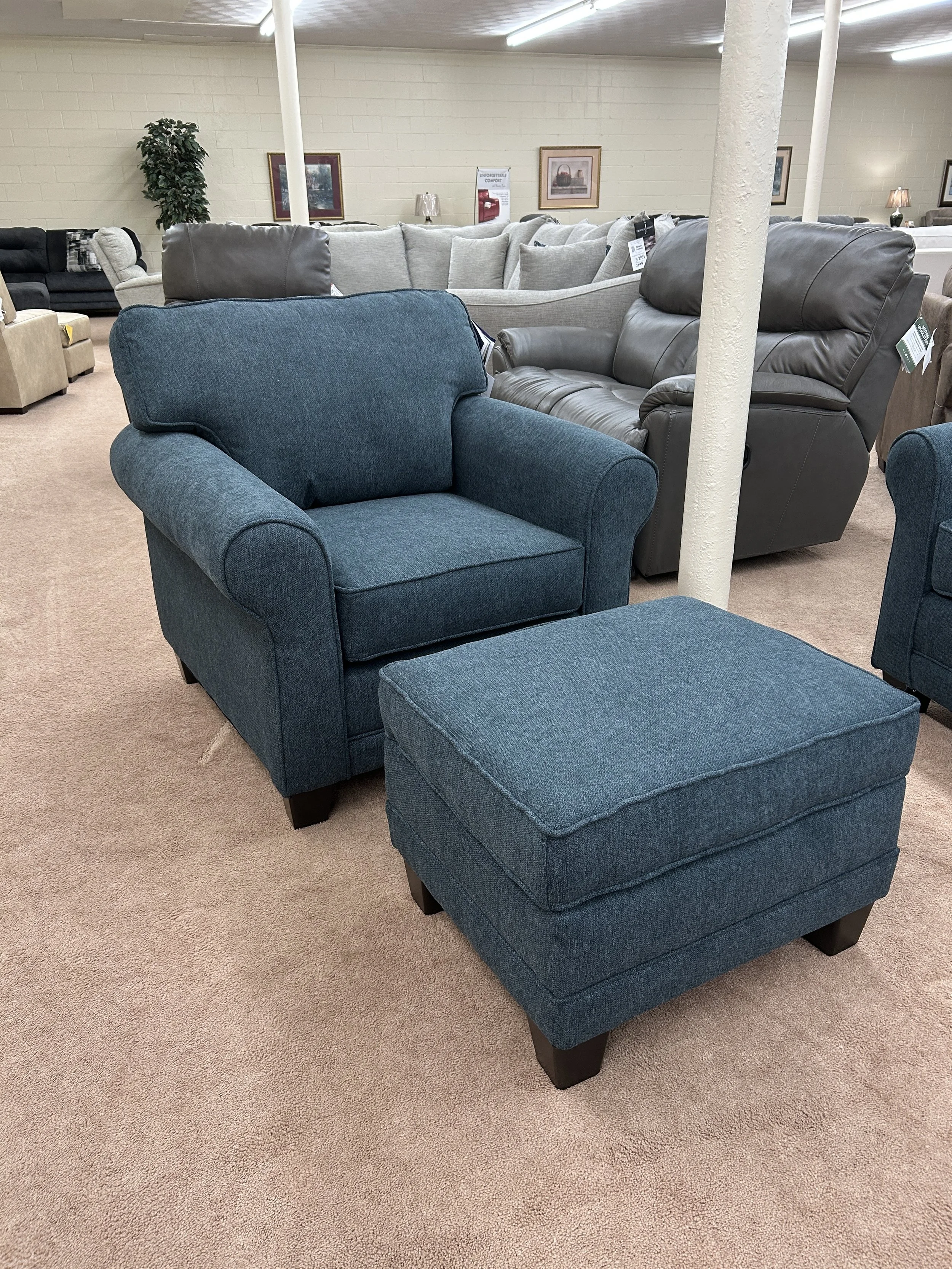 Hughes Furniture chair & ottoman in Lotus Aegean dark blue fabric