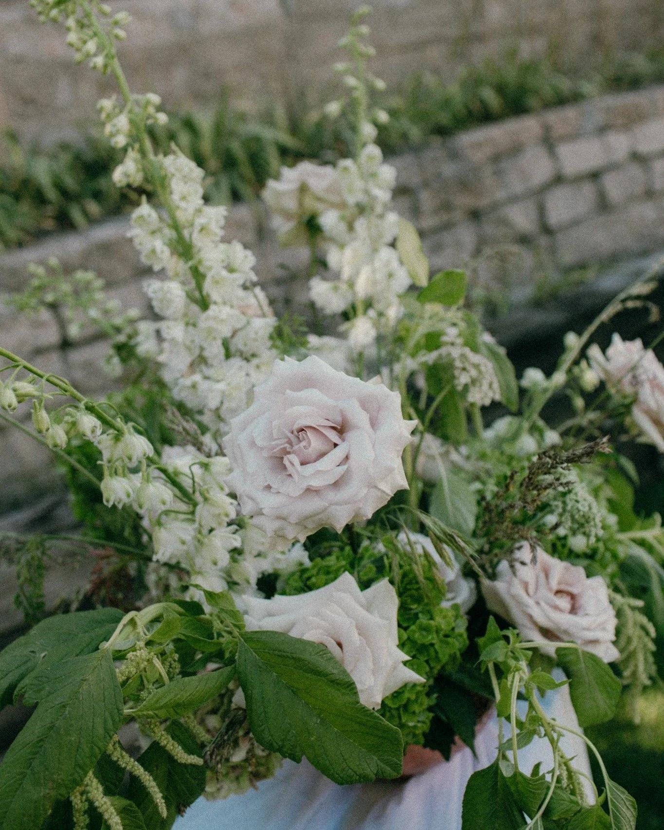 The key moment in a four-part story. The ceremony.

Where the world falls quiet. Where time slows. Where two people share their love, surrounded by everyone who brought them here.
Florals are shaped to frame, not distract &mdash; to enhance the space