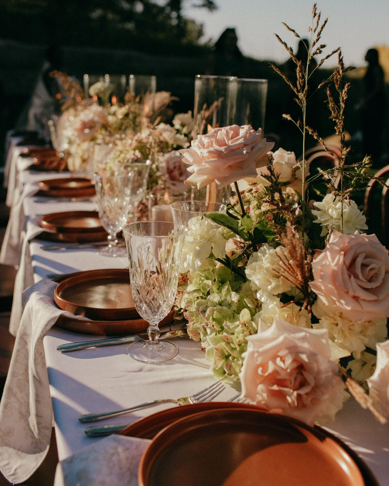 The moment to stay awhile &mdash; the reception.

The table where the celebration settles in. Where laughter stretches longer, glasses refill, and stories are shared between bites.
Layered textures and naturally gathered florals create a setting mean