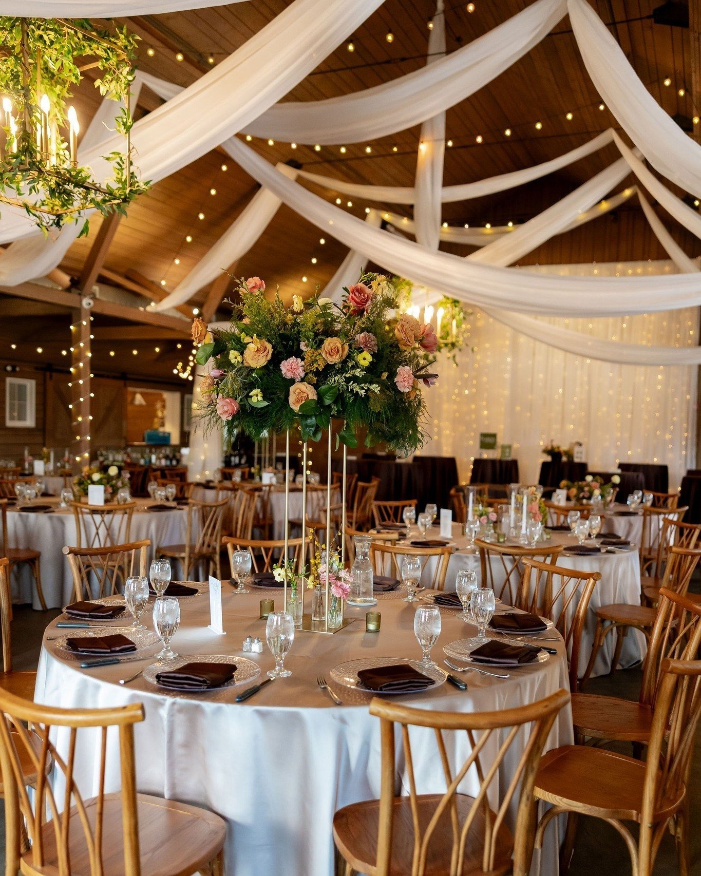 A beautifully layered event starts with thoughtful design.

Dainty Details curates the specialty rentals that shape the space, while Dahlia Dream designs florals that echo and expand the color palette throughout the room. Together, those elements tra