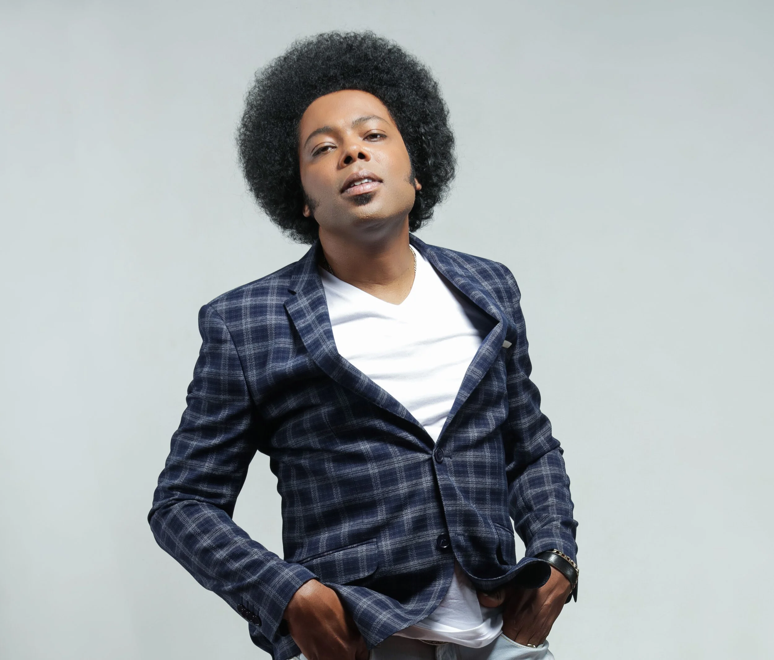 Cuban-Canadian singer-songwriter Alex Cuba plays live locally, July 14, 15, and 18