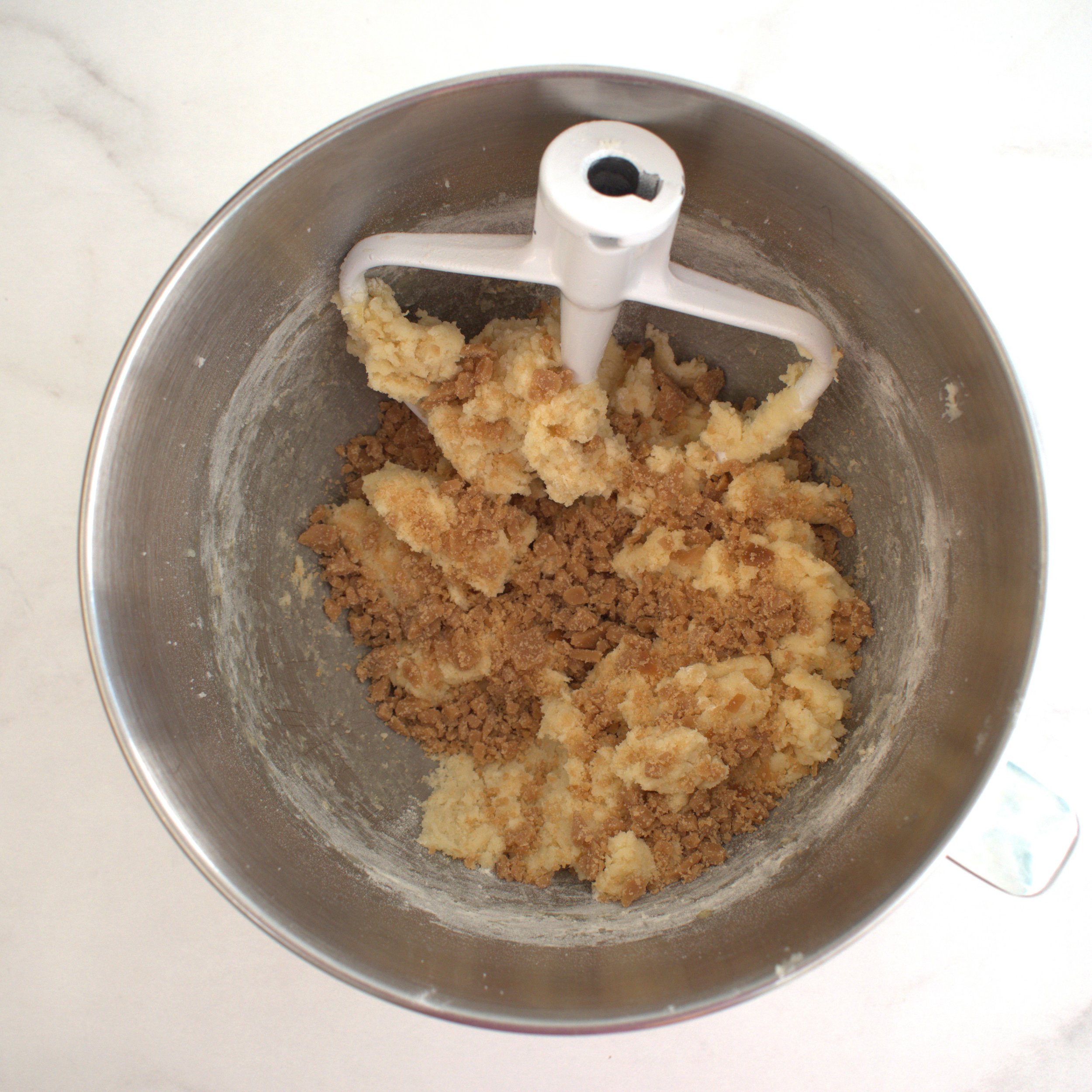 adding toffee to snickerdoodle cookie dough.jpg