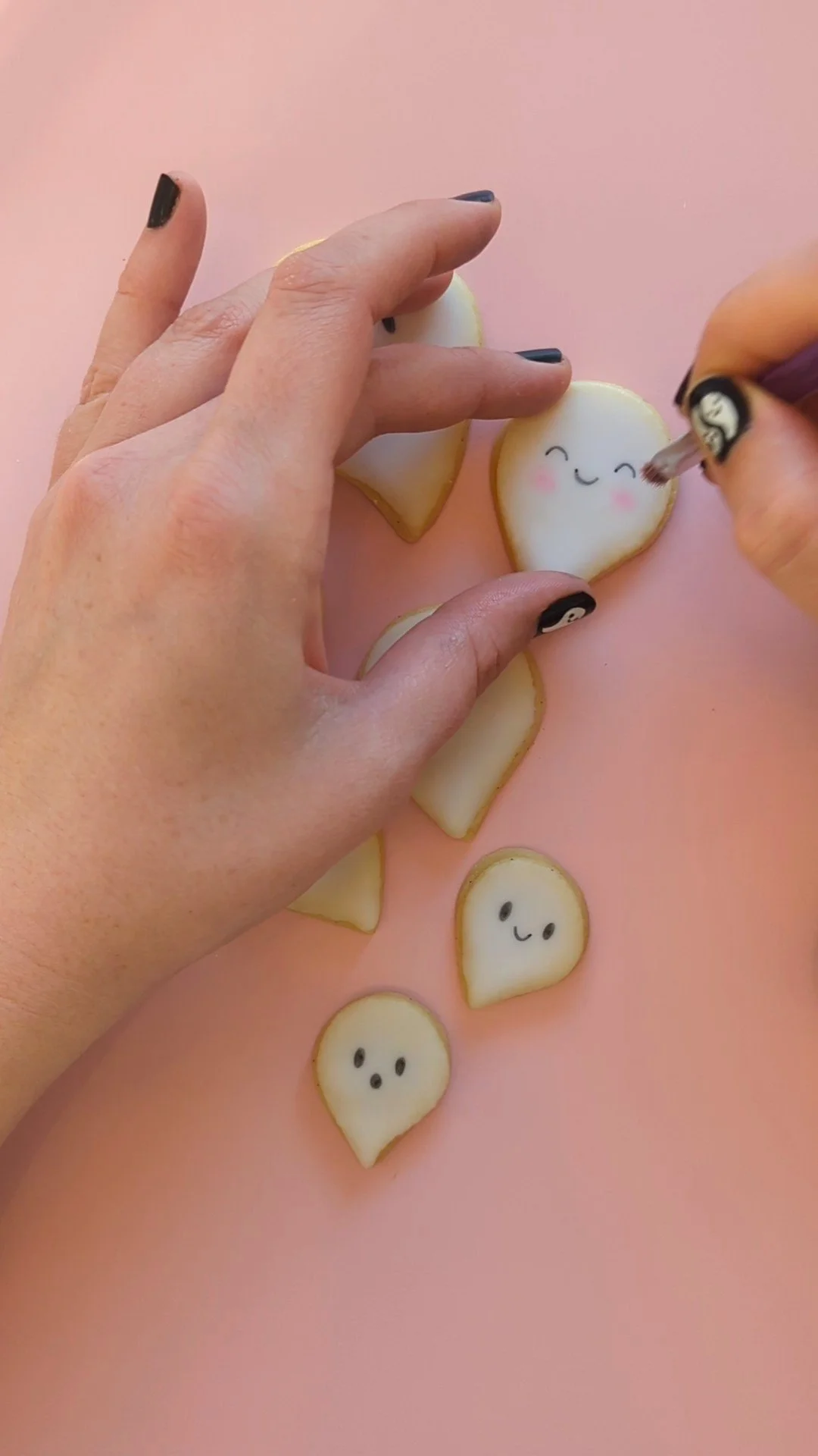adding blush to ghost cookies.jpg