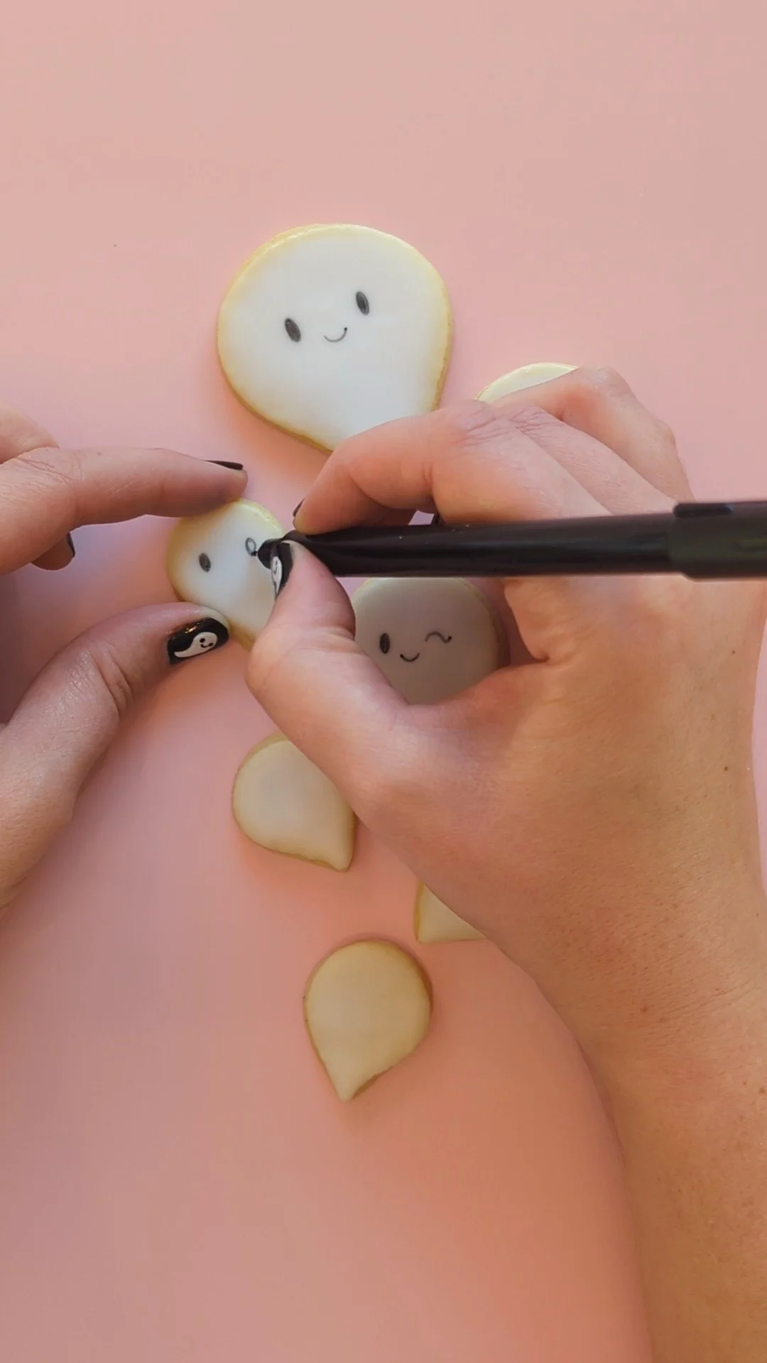 adding faces to ghost cookies.jpg