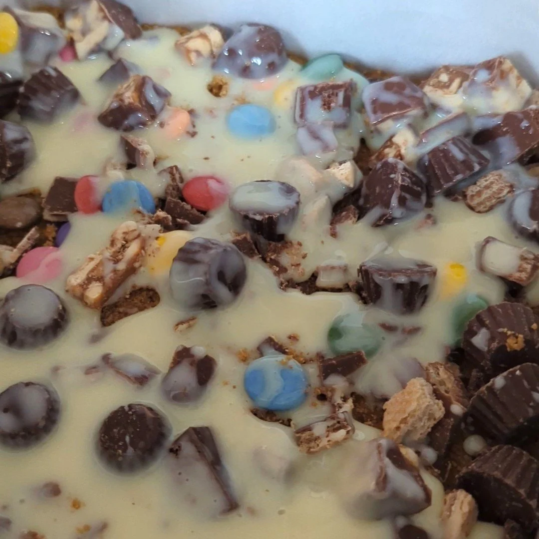 adding condensed milk to magic bars.jpg