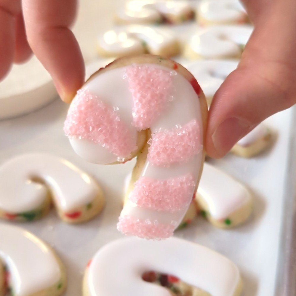 sanding sugar on candy cane cookies.jpg
