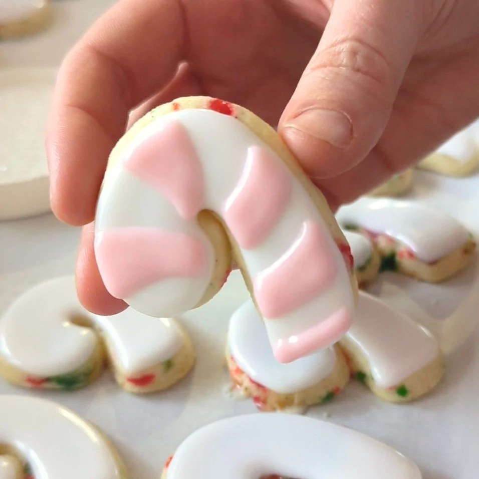 stripes on mini candy cane cookies.jpg